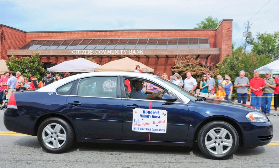U.S. Air Force Col. Christopher Short, 23rd Wing vice commander, participates in the Honeybee Festival parade in Hahira, Ga., Oct. 8, 2011. Short was the honored military guest during the parade. (U.S. Air Force photo by Staff Sgt. Stephanie Mancha/Released)