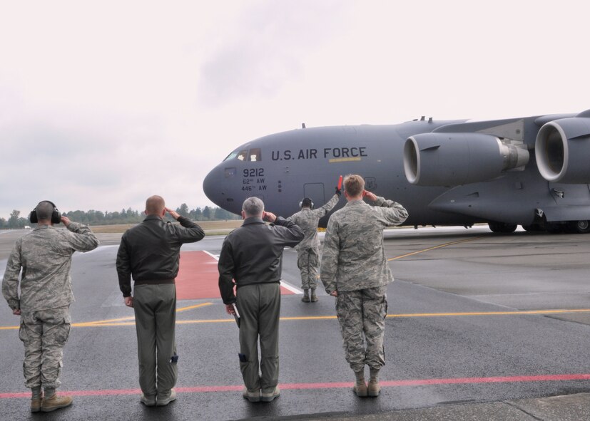 Leaders from the 62nd Airlift Wing salute as McChord Field’s newest C-17 Globemaster III taxis down the runway Oct. 6, 2011, at Joint Base Lewis-McChord, Wash. (U.S. Air Force photo/Airman 1st Class Leah Young)