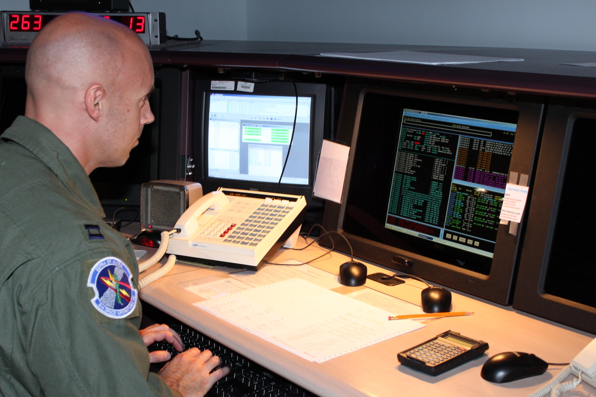 SCHRIEVER AIR FORCE BASE, Colo. -- Capt. David Dwiggins recovers Air Force Priority 1 environmental intelligence data from a DMSP satellite.

