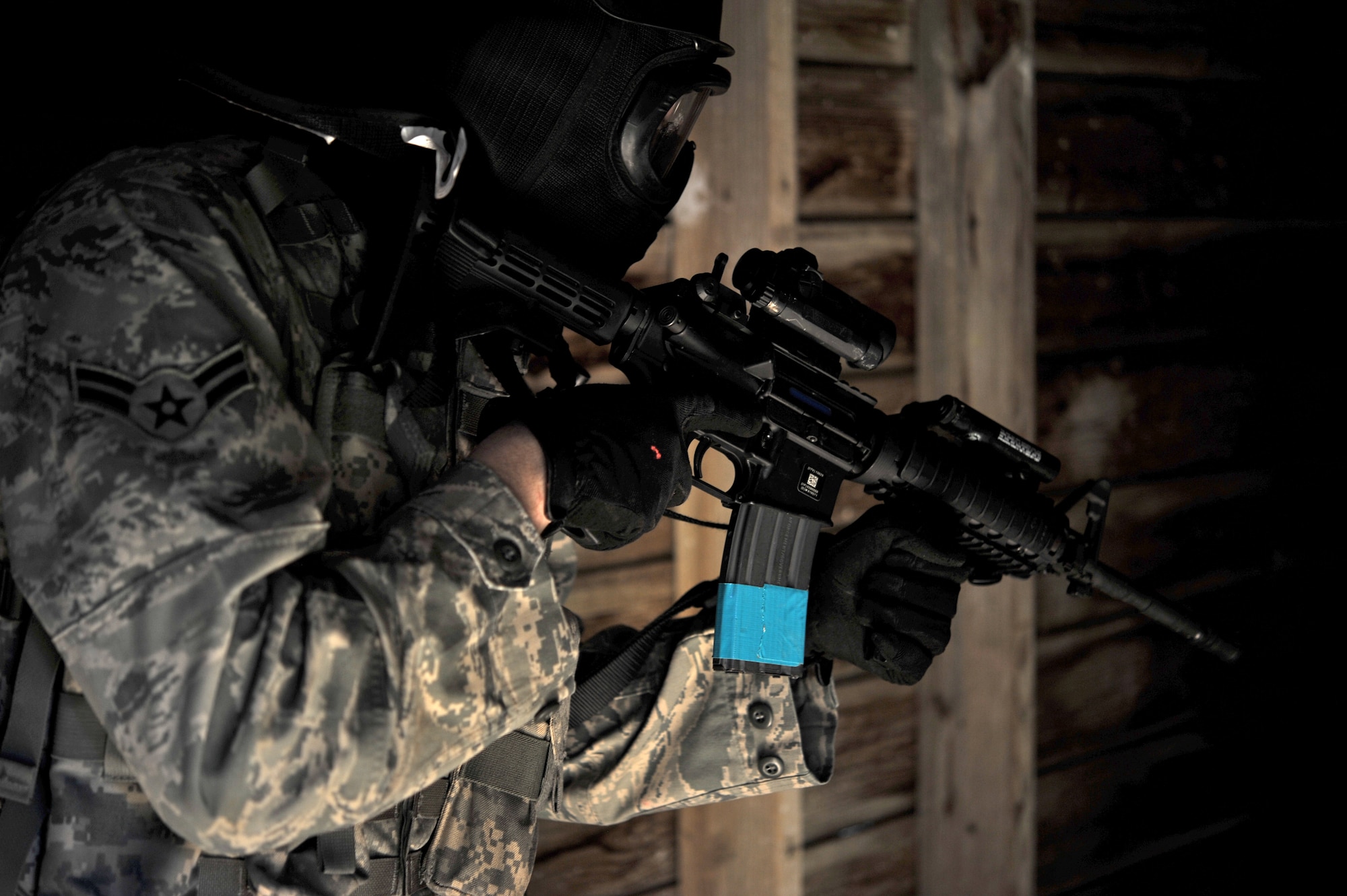 Airman 1st Class Bradley Browning, a 71st Security Forces Squadron member at Vance Air Force Base, Okla., clears a room during mount training at Camp Gruber, Okla., Sept. 27. Security Forces Airmen fired approximately 13,000 5.56 mm rounds at pop-up targets and more than 2,500 simunitions during two days of training. (U.S. Air Force photo/ Staff Sgt. James Bolinger) 
