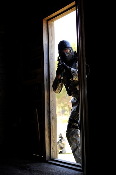 Tech. Sgt. Scott Robertson, a 71st Security Force Squadron member at Vance Air Force Base, Okla., enters a building during mount training at Camp Gruber, Okla., Sept. 27. The Airmen were searching for a weapons cache and battling an insurgent threat using simunitions. (U.S. Air Force photo/ Staff Sgt. James Bolinger)