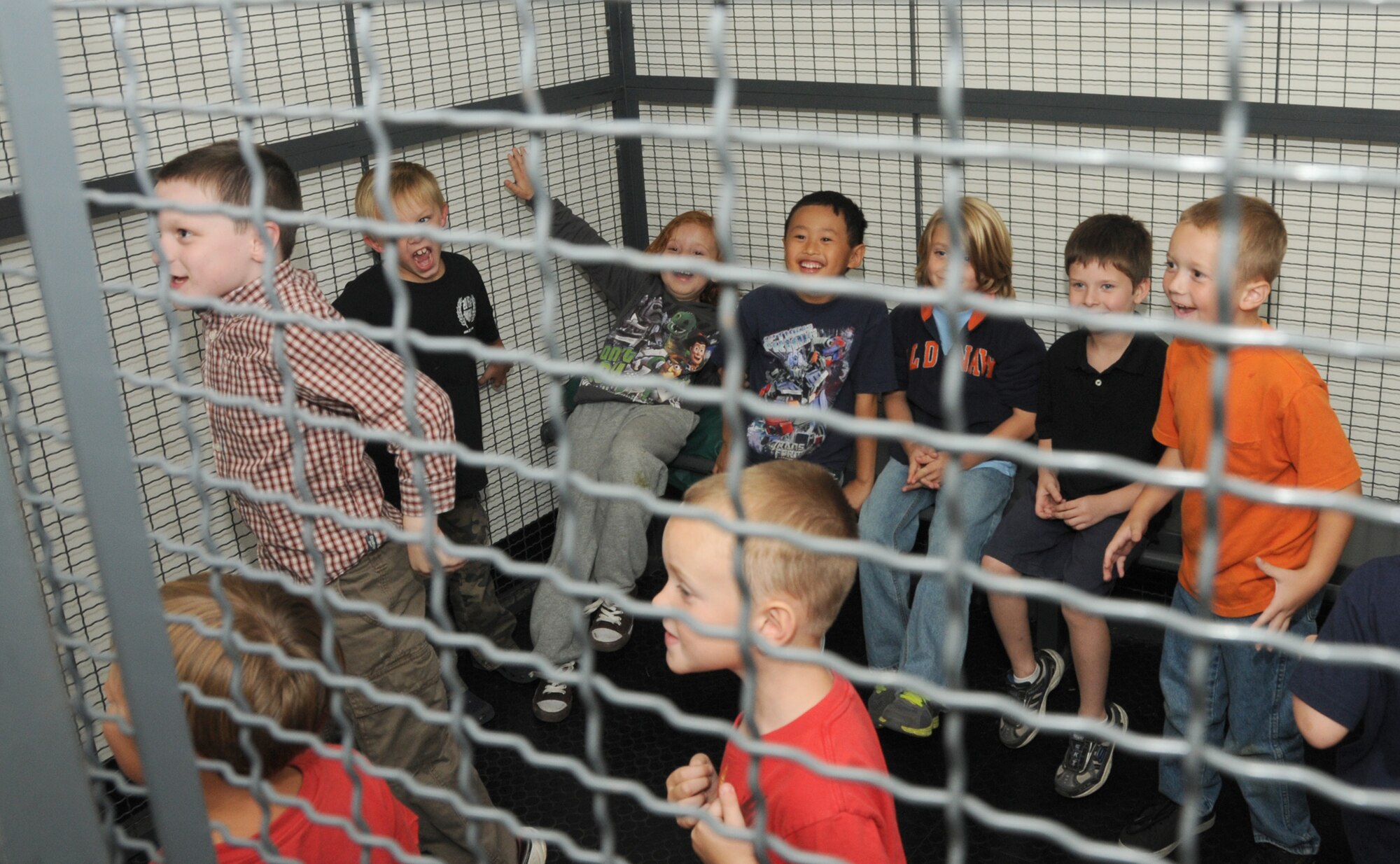 Tiger Cub Scout Pack 208 of Biloxi had a little run in with the law at about 7 p.m. Oct. 4. As a result, the whole pack of scouts was locked in a holding cell during their tour of the 81st Security Forces Squadron, Keesler Air Force Base, Miss.  All smiles, the pack showed no signs of remorse as they were given a tour of the desk,  onfinement area, a no-touch weapons display and a police car. The rascaly crew was also given a briefing by an 81st SFS defender on what it’s like to be a police officer.  (U.S. Air Force photo by Kemberly Groue)