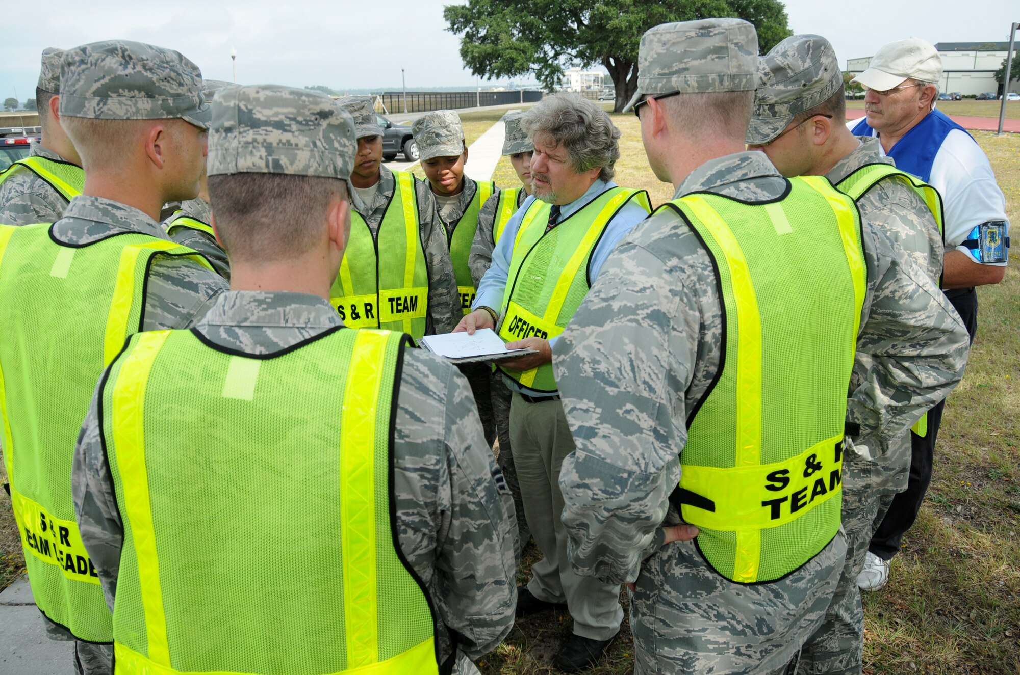 At center, James Taylor, Keesler mortuary affairs officer, Keesler Air Force Base, Miss., assigns specific duties to the members of his search and recovery team during a major accident response exercise October, 2010.  (U.S. Air Force photo by Kemberly Groue)