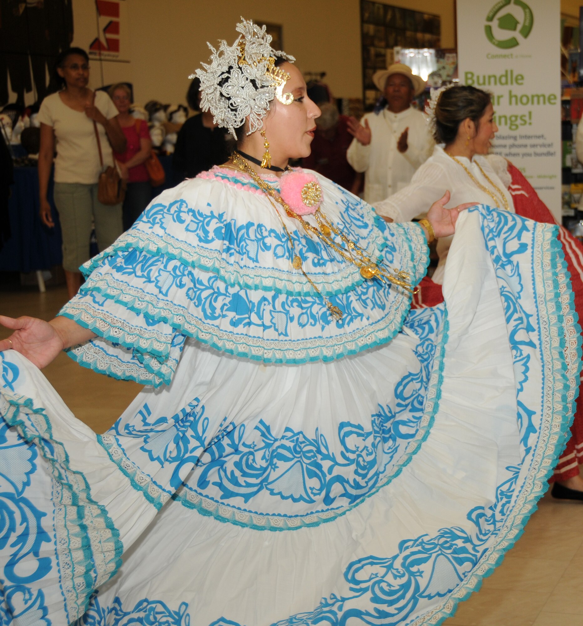 Elisa Ortegon performs with the Panama Without Borders Folkloric Dance Group from Biloxi Oct. 8 during the Hispanic Heritage Month celebration at the main exchange, Keesler Air Force Base, Miss.  Ortegon's husband is Navy retiree Caesar Ortegon.  The group performed 12 dances attired in traditional Panamanian costumes.  (U.S. Air Force photo by Kemberly Groue)