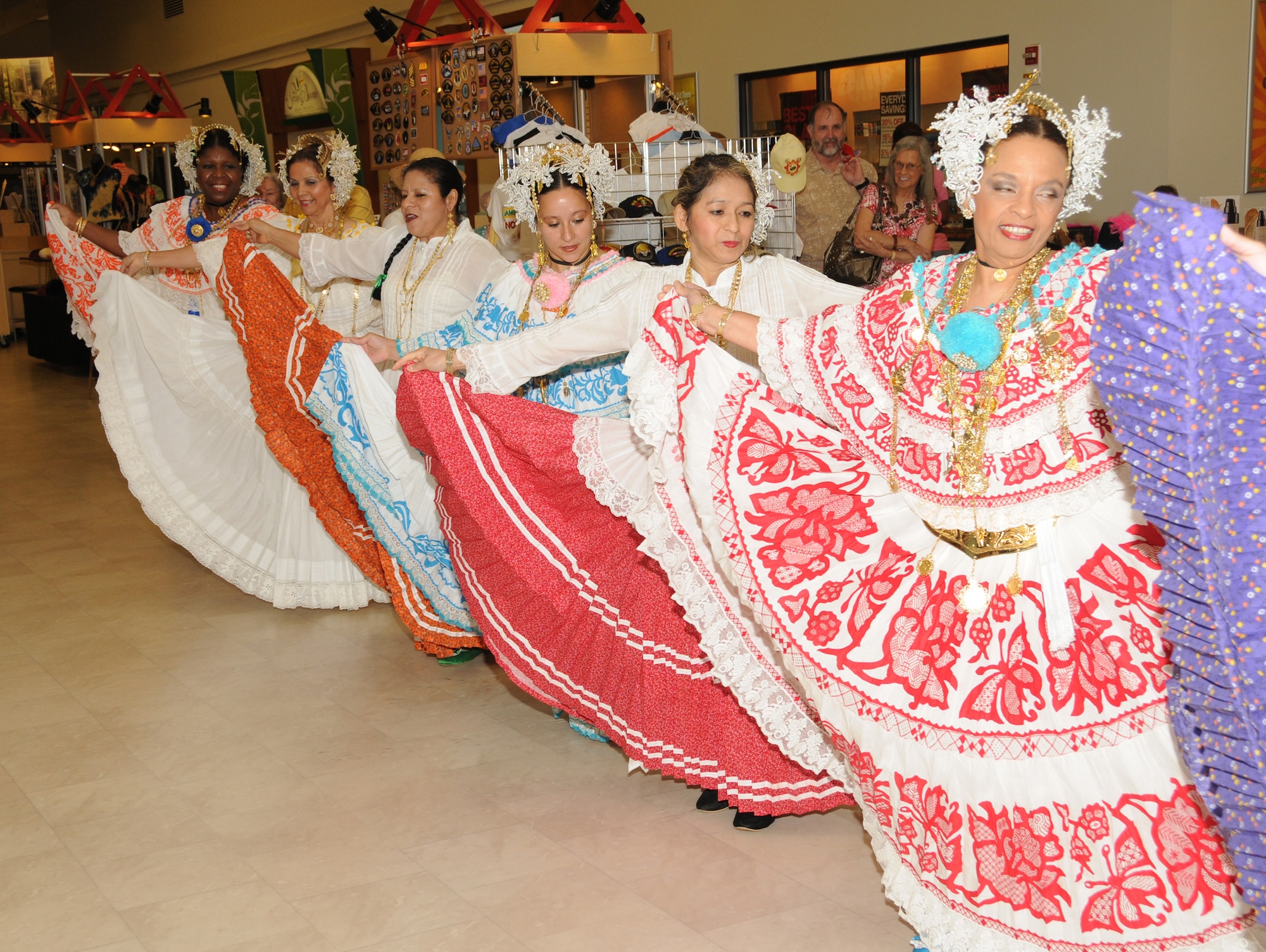 “Grupo Folklorico Panama Sin Fronteras” performed Panamanian folk dances Oct. 8 at the main exchange, Keesler Air Force Base, Miss., in honor of Hispanic Heritage Month. The group is comprised of military retirees and spouses in traditional attire called “La Pollera.”  Audience members were paired up with members of the group to celebrate carnival-style to close out the event.  (U.S. Air Force photo by Kemberly Groue)