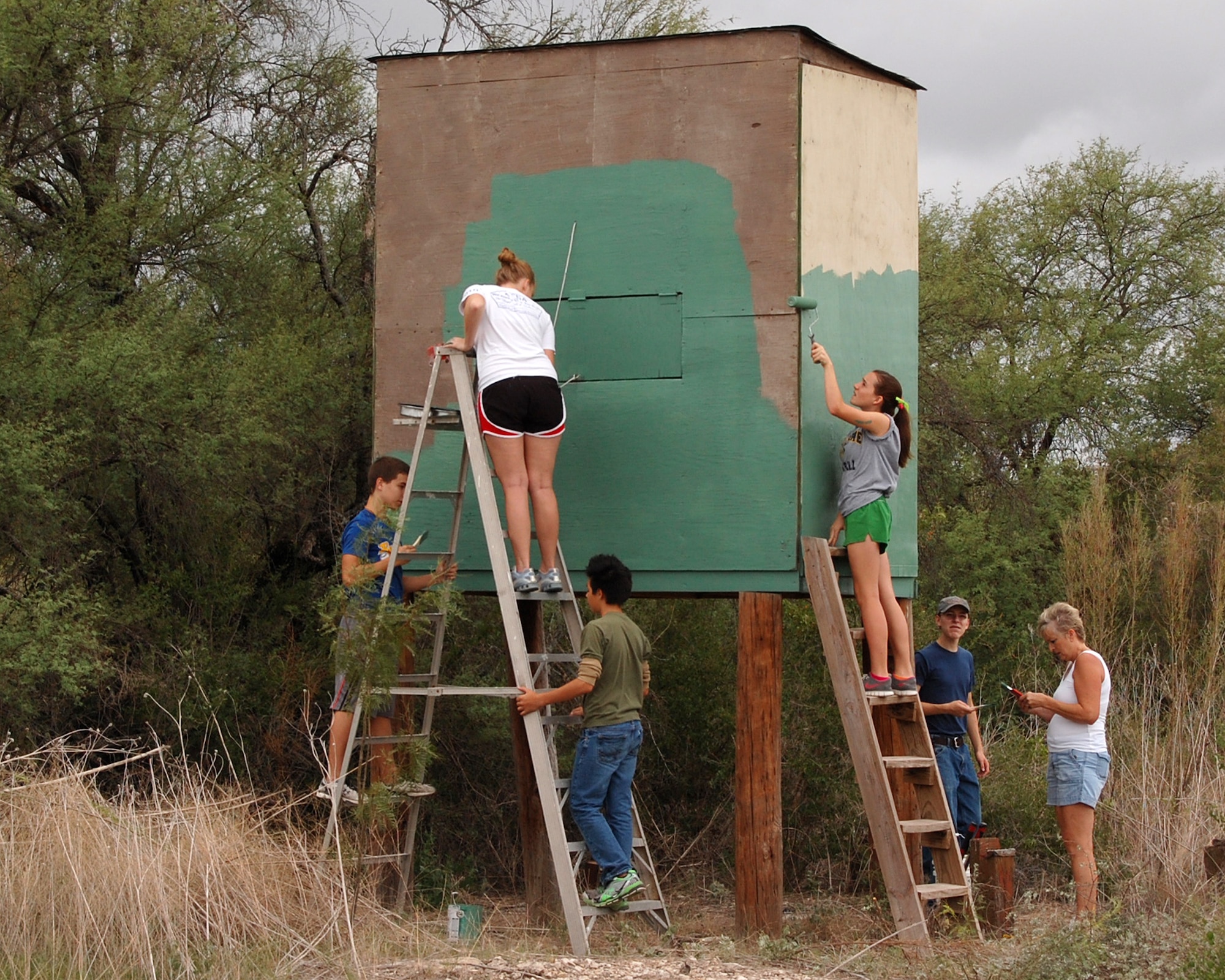 LAUGHLIN AIR FORCE BASE, Texas - Scouts from troop 255 and volunteers from First Christian Church in Del Rio repair and paint a deer blind on base. The workers repaired the stands on Oct. 8, as part of an Eagle Scout project. (U.S. Air Force photo/Master Sgt. Peter Borys)