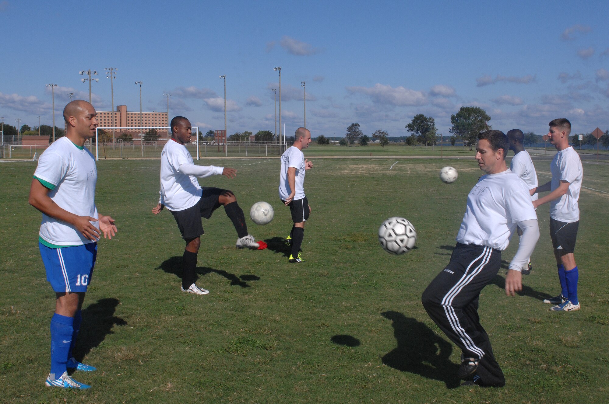 Recruits of the 2011-2012 All Air Force Men’s Soccer team perform passing drills during the All Air Force Soccer Trial and Training Camp held at Langley Air Force Base, Va., Oct. 4, 2011. Soccer players from all over the world are taking part in three weeks of soccer trials to be evaluated for a spot on the 2011-2012 All Air Force, Men’s Soccer Team. (U.S. Air Force photo by Staff Sgt. Antoinette Gibson/Released)