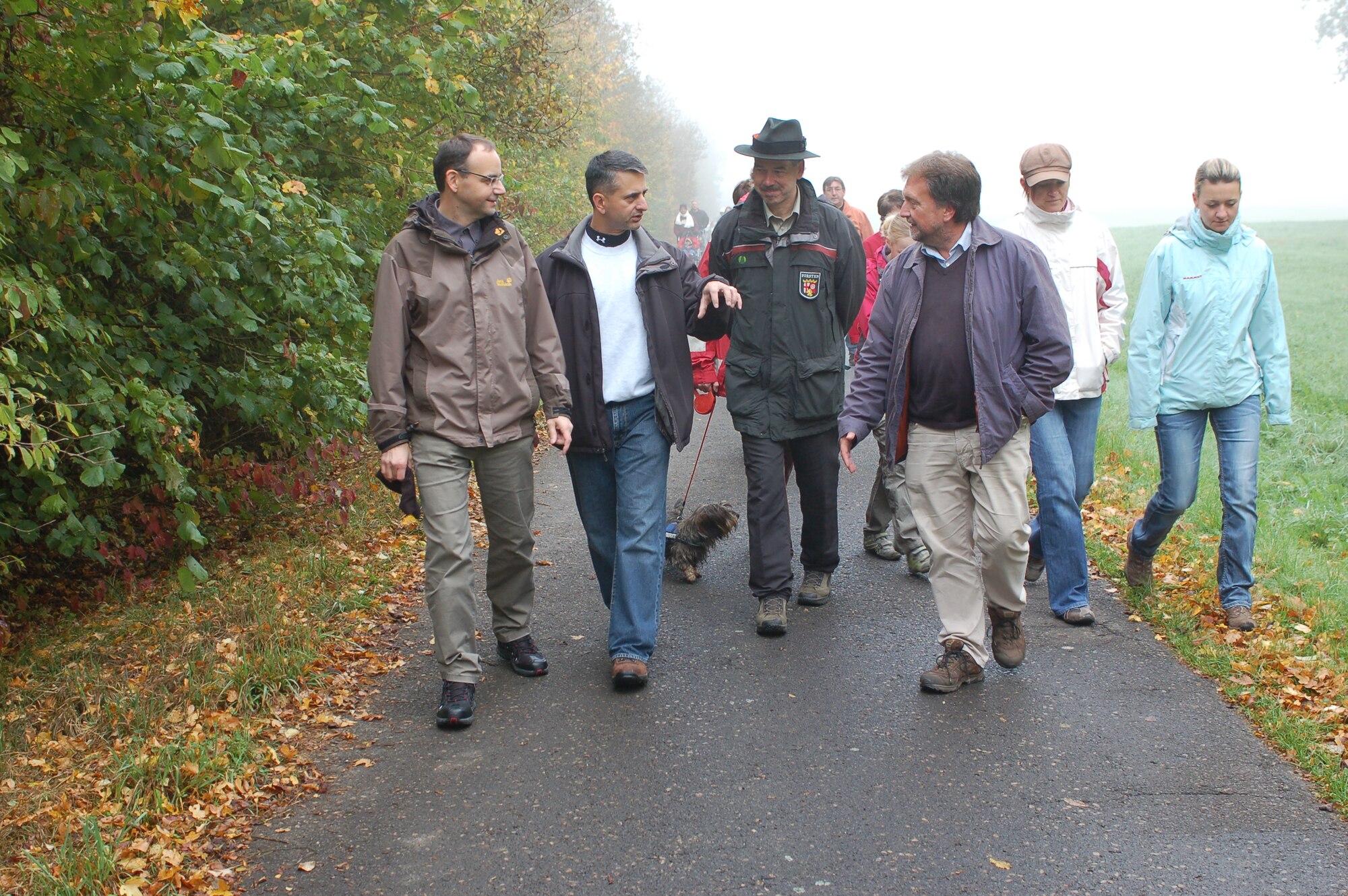 BINSFELD, Germany – From left to right, Walter Faber, Binsfeld mayor; Col. David Julazadeh, 52nd Fighter Wing vice commander;  a local forest master; and Bernhard Schaefer, community relations advisor, talk with each other during the annual forest walk here Oct. 9. Nearly 100 people came to the walk that went through the Binsfeld Kaasweg forested area. The forest master taught children about trees, plants and animals in the Eifel area during the walk. The community invited all participants to a traditional soup luncheon at the town hall after the walk. (U.S. Air Force photo/Iris Reiff)