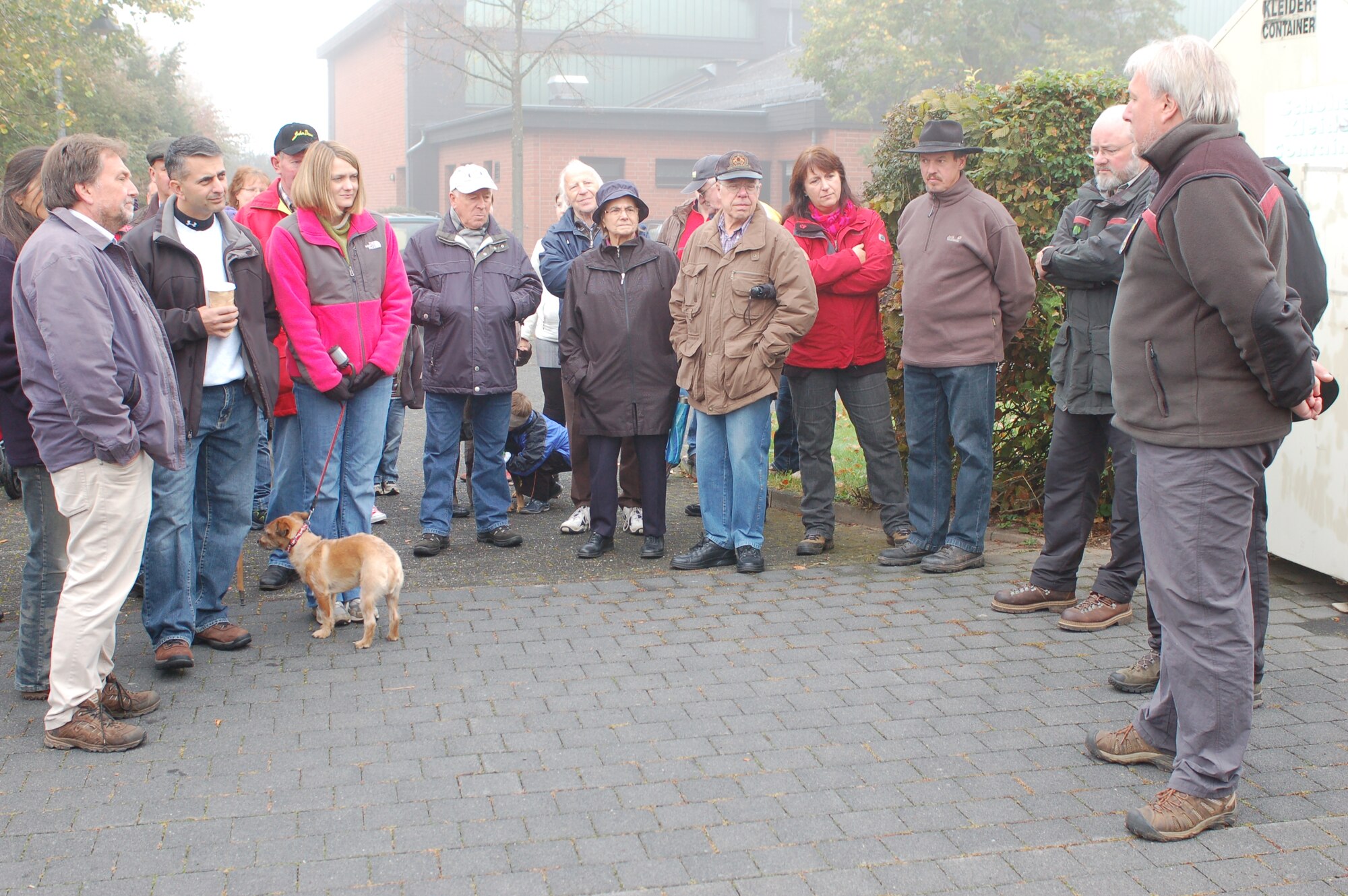 BINSFELD, Germany -- A local forest master, right, introduces himself to a group of participants of the annual forest walk here Oct. 9. Among the 52nd Fighter Wing’s participants were Col. David Julazadeh, vice commander; his wife, Kate; Bernhard Schaefer, community relations advisor; and his wife, Gertrud. Nearly 100 people came to the walk that went through the Binsfeld Kaasweg forested area. The forest master taught children about trees, plants and animals in the Eifel area during the walk. The community invited all participants to a traditional soup luncheon at the town hall after the walk. (U.S. Air Force photo/Iris Reiff)