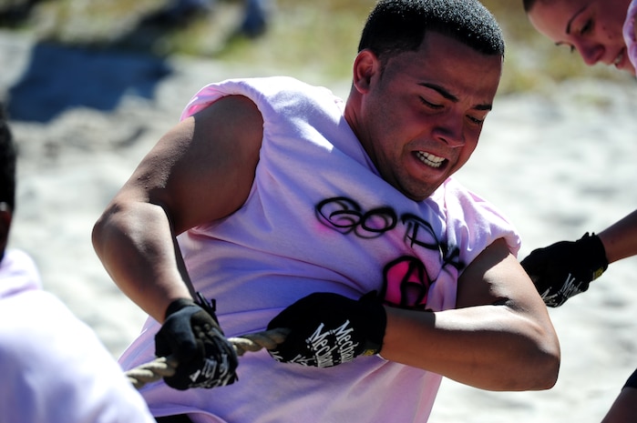 Senior Airman Christopher Ramos from the Go Pink team, participates in the tug-of-war challenge during the Festival of Fitness Oct. 7, at Joint Base Charleston.  Seventeen, six-man teams competed in the Festival of Fitness which included a 5k run, tug-of-war, trivia questions and a team fitness relay. The 628th Civil Engineer Squadron Lime Green team was named the overall winner. Ramos is from the Logistics Readiness Squadron. (U.S. Air Force photo/ Staff Sgt. Nicole Mickle)       