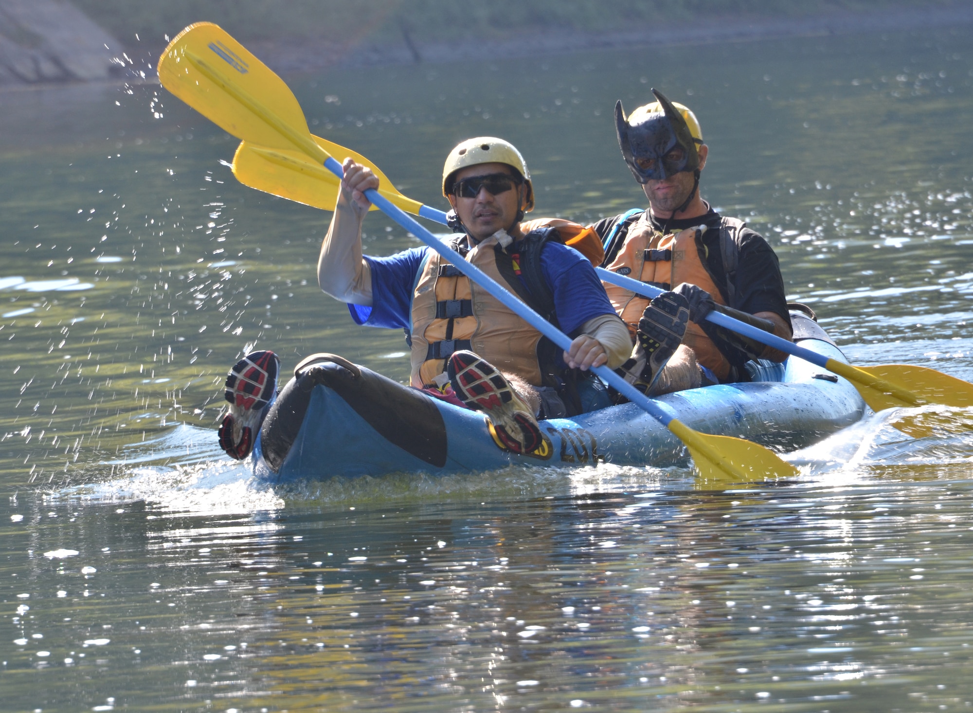 U.S. Army Chief Warrant Officer Rolando Sanchez and Sgt. 1st Class Jason Loveday, Team America Global Police, finish the “duckie” race of the 11th Annual Wilderness Challenge, Oct. 8, 2011, in Fayetteville W.Va. The inflatable-canoe race was one of two water races held during the wilderness challenge; the other was a white-water race. (U.S. Air Force photo by Tech. Sgt April Wickes/Released)