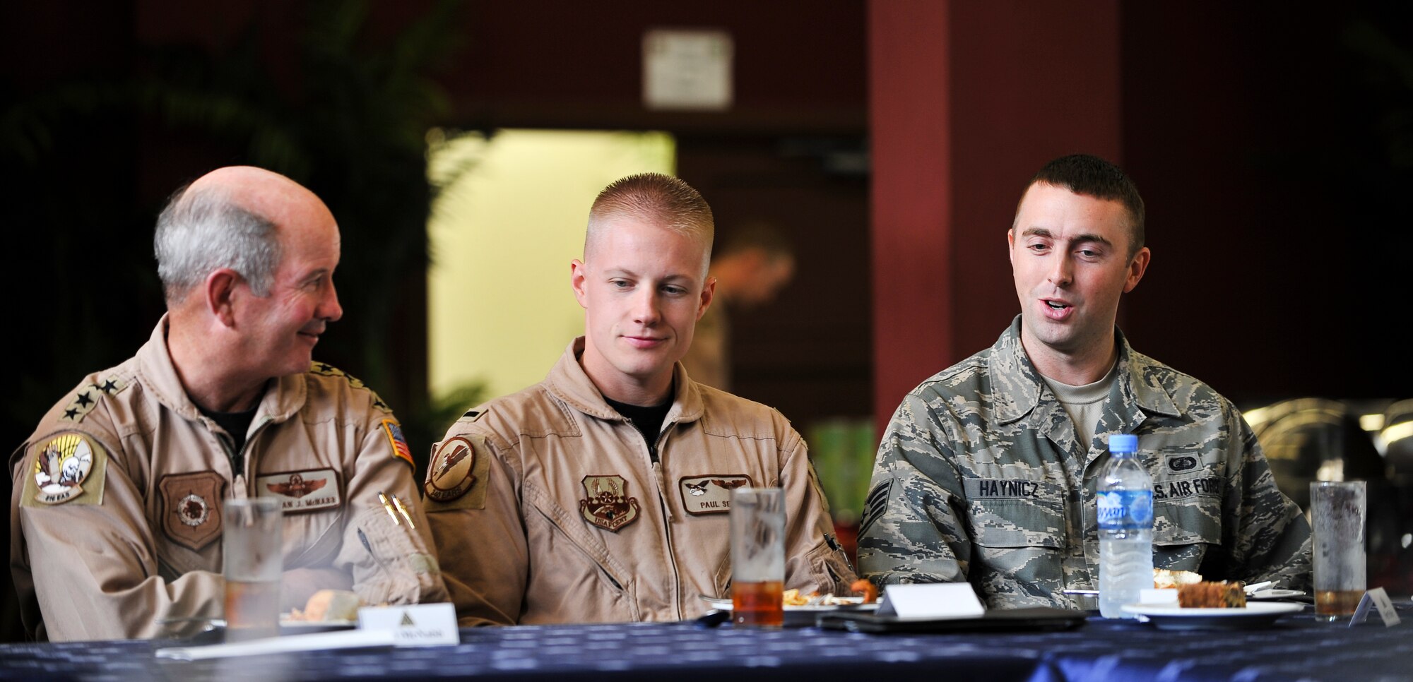 Gen. Duncan J. McNabb, commander,  U.S. Transportation Command, chats with Staff Sgt. Paul Haynicz (far right), 379th Expeditionary Contracting Squadron contingency contracting officer, during a luncheon Oct. 4, 2011, at an undisclosed location in Southwest Asia. McNabb’s visit was just one stop on a tour of bases throughout the U.S. Central Command Area of Responsibility to thank servicemembers for their sacrifice and dedication. USTRANSCOM is the single manager for global air, land and sea transportation for the Department of Defense. The general is scheduled to retire Nov. 30, 2011, after more than three decades of service. Haynicz, a native Monroeville, N.J., is deployed from Patrick Air Force Base, Fla. (U.S. Air Force photo/Senior Airman Paul Labbe)