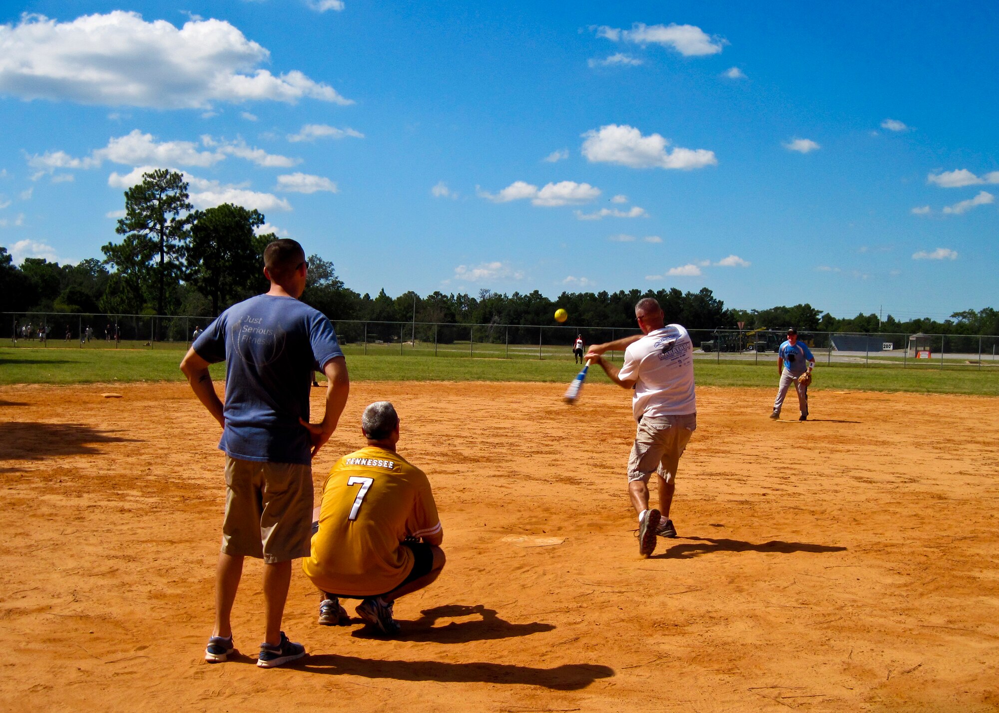 Senior Master Sgt. Jamie Jordan takes a swing during a game of softball during the 33rd Fighter Wing's Wingman Day Oct. 7. The 33rd Fighter Wing's Sailors, Marines and Airmen took some time off from F-35 preparations to come together for some Wingman Day activities.  (U.S. Air Force photo/Maj. Karen Roganov)
