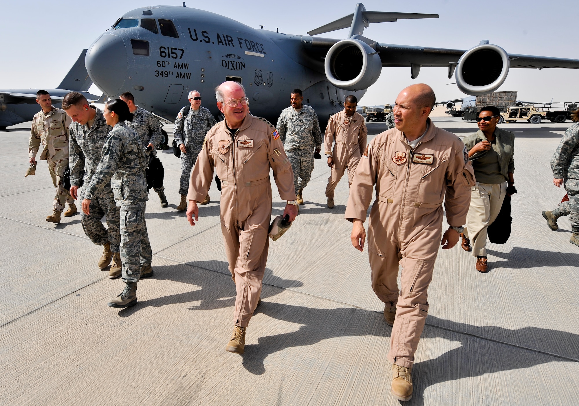Gen. Duncan J. McNabb (center), commander,  U.S. Transportation Command, is greeted by Col. Giovanni Tuck, 379th Air Expeditionary Wing commander, during the general’s visit Oct. 4, 2011, to an undisclosed location in Southwest Asia. McNabb’s visit was just one stop on a tour of bases throughout the U.S. Central Command Area of Responsibility to thank servicemembers for their sacrifice and dedication. USTRANSCOM is the single manager for global air, land and sea transportation for the Department of Defense. The general is scheduled to retire Nov. 30, 2011, after more than three decades of service. (U.S. Air Force photo/Senior Airman Paul Labbe)