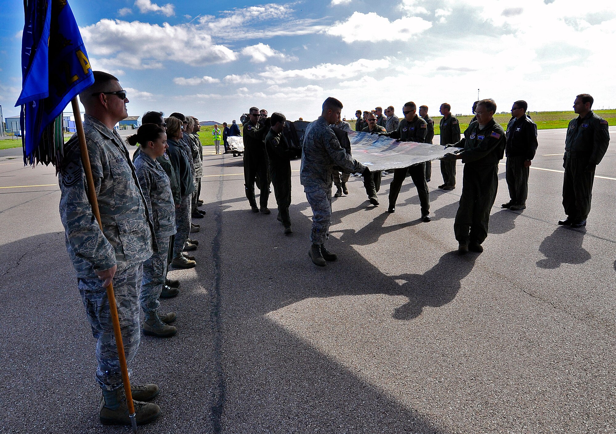 Reserve Airmen from the 514th Air Mobility Wing load the wreckage of a B-17 Flying Fortress onto a C-17 Globemaster III at an airport in Caen, France, Sept. 23, 2011. The Airmen were in France to repatriate the bomber which crashed in World War II. (Photo by Tech. Sgt. Shawn J. Jones)