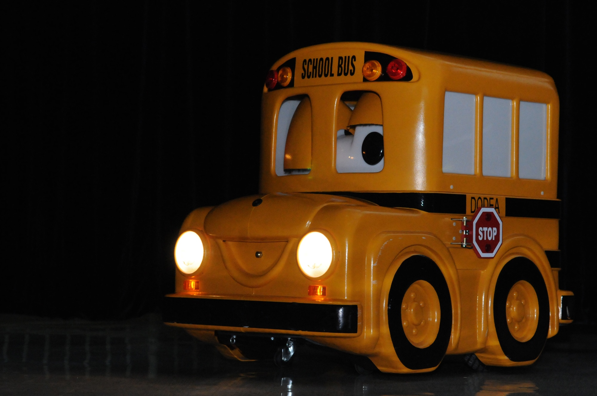 Buster, the talking school bus, speaks with children at Andersen Elementary School here, Oct 7. Buster is part of an education program DoD Education Activity uses to teach children about school bus safety and rules. (U.S. Air Force photo/ Senior Airman Carlin Leslie)