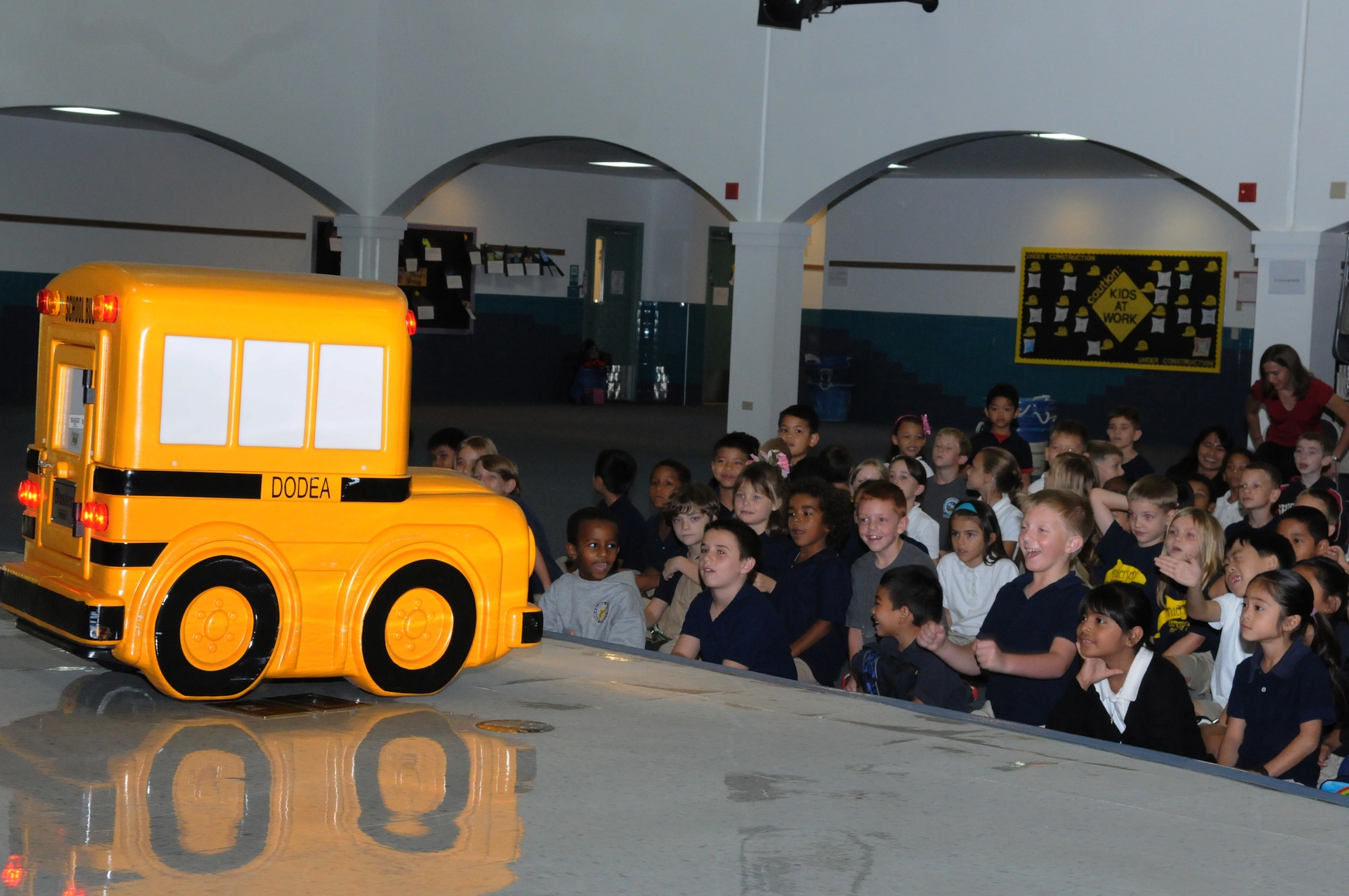 Buster, the talking school bus, speaks with children at Andersen Elementary School here, Oct 7. Buster is part of an education program DoD Education Activity uses to teach children about school bus safety and rules. (U.S. Air Force photo/ Senior Airman Carlin Leslie)