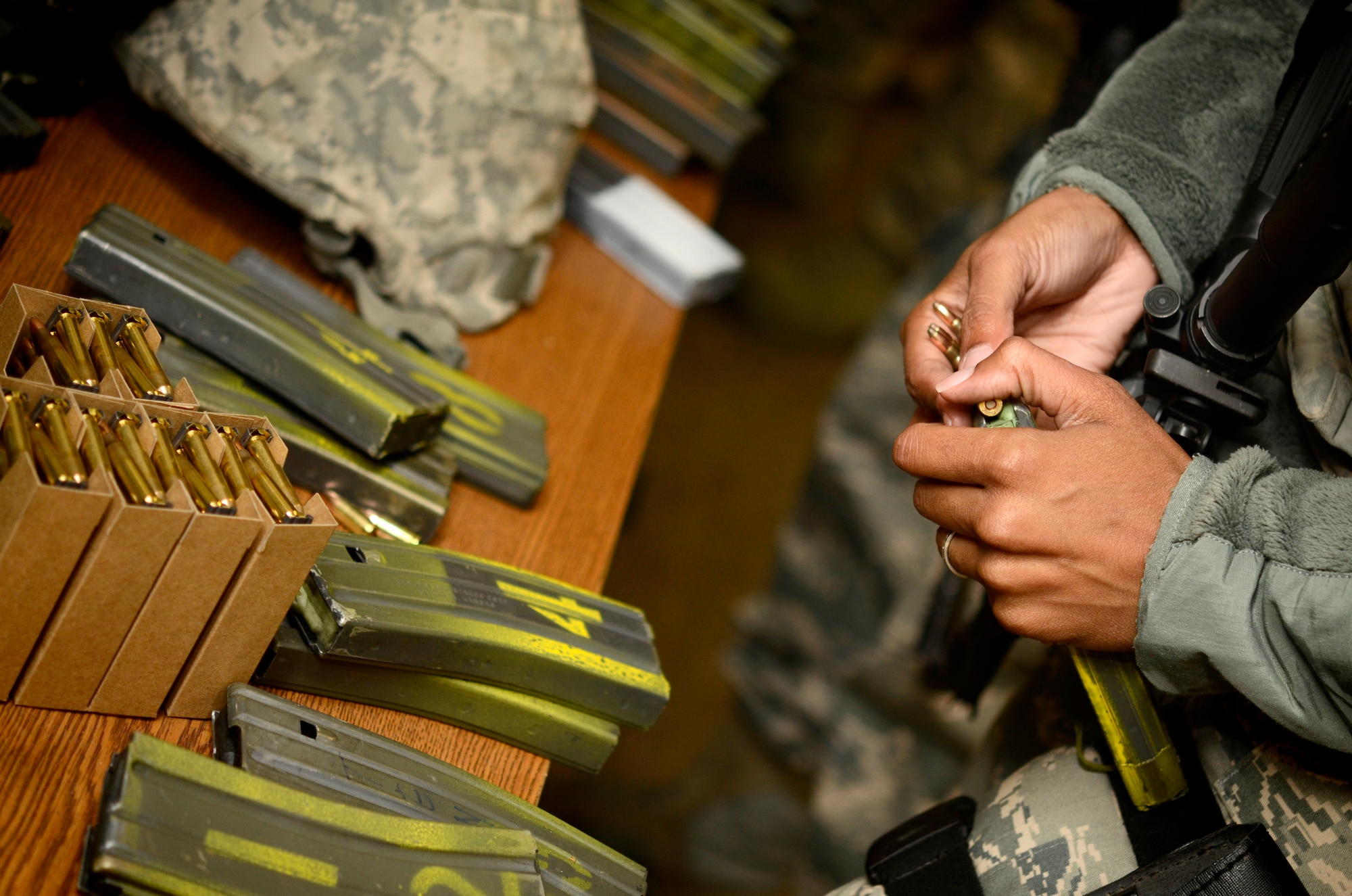 VOGELWEH, Germany – An Airman loads ammunition into a clip before firing in the new Air Force rifle qualification course Oct. 7. The new course of fire has a mandatory implementation date of Dec. 1, 2011. (U.S. Air Force photo/Staff Sgt. Benjamin Wilson)