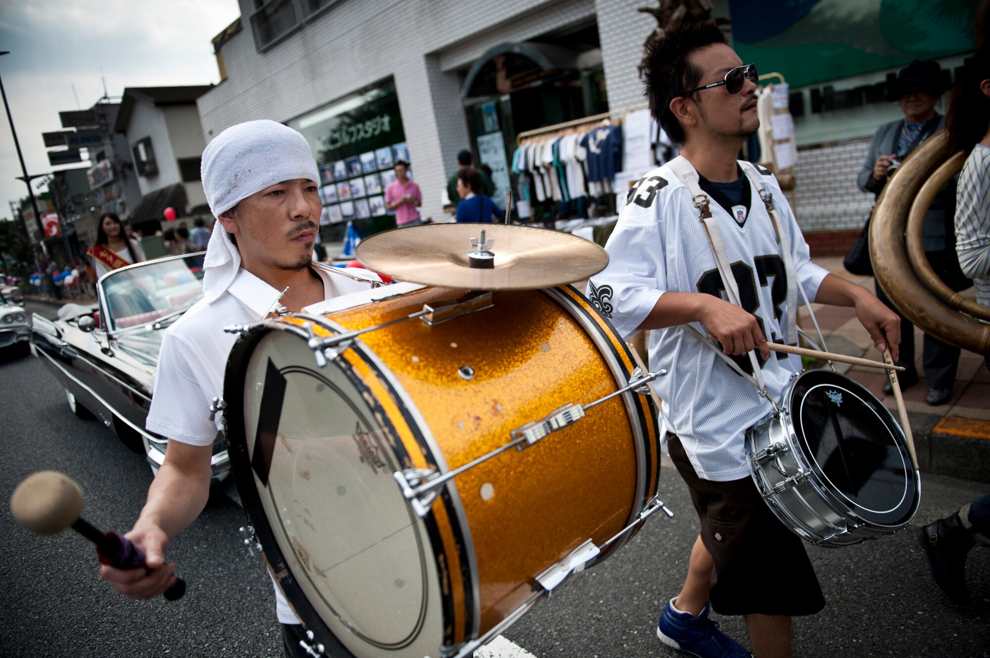FUSSA CITY, Japan -- Members of Dew Drop Funkin' Horns, a Japanese jazz band, perform on Route 16 during the Fussa City International Fair, Oct. 9, 2011, in Fussa City, Japan. The second day of the fair included a parade of musicians, U.S. servicemembers, antique cars and more. (U.S. Air Force photo/Staff Sgt. Samuel Morse)