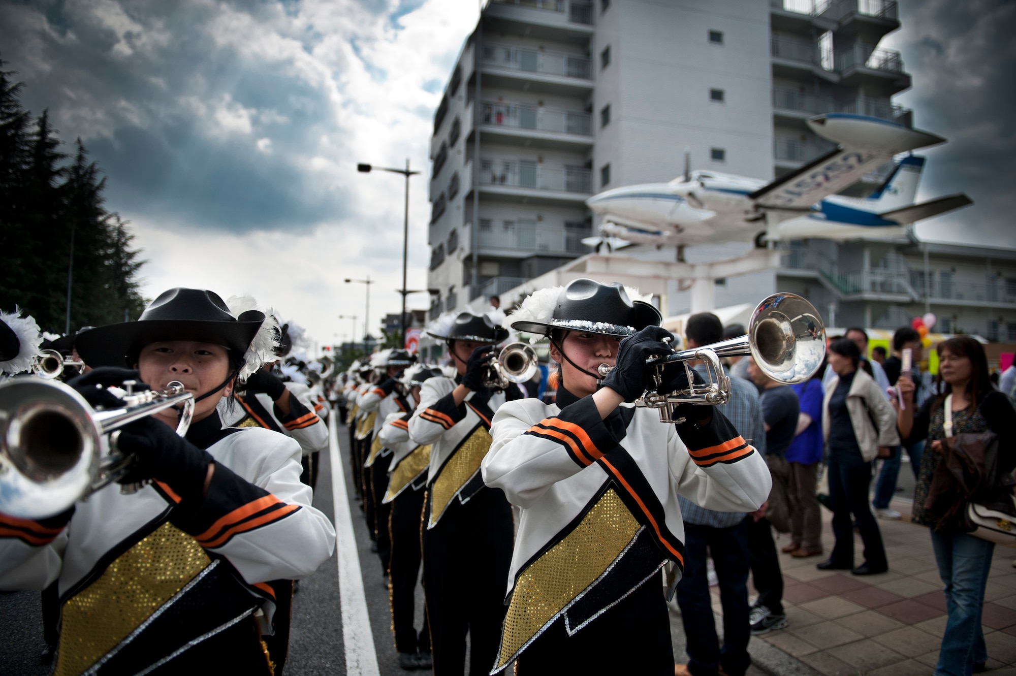 FUSSA CITY, Japan -- The Saitama Sakae Junior and Senior High School Marching Band performs on Route 16 during the Fussa City International Fair, Oct. 9, 2011, in Fussa City, Japan. The fair lasted two days and included music, food and a parade. (U.S. Air Force photo/Staff Sgt. Samuel Morse)