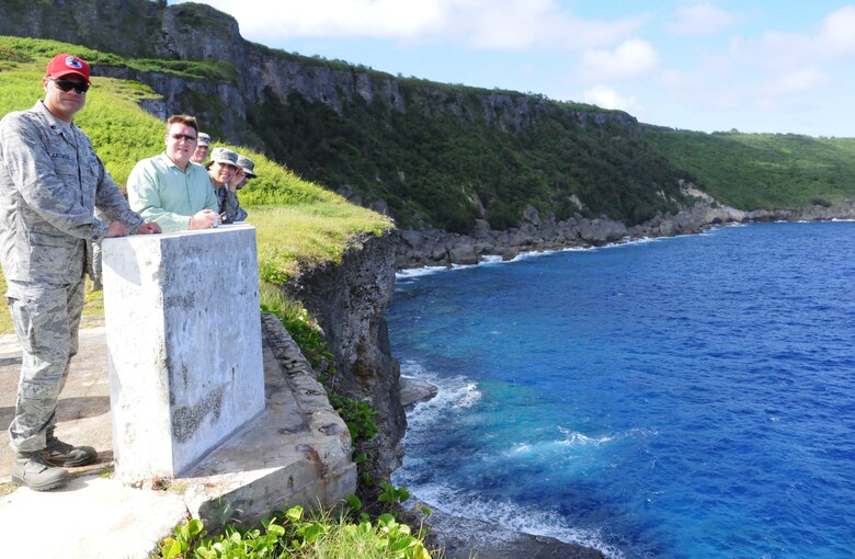 ANDERSEN AIR FORCE BASE, Guam – Senior leaders of Team Andersen pose for a group photo atop of a memorial during a staff visit and historical tour of Tinian Island, Oct. 11. Tinian Island has multiple historical sites throughout the jungle and areas honoring the heritage of the island. (U.S. Air Force photo/ Senior Airman Carlin Leslie)