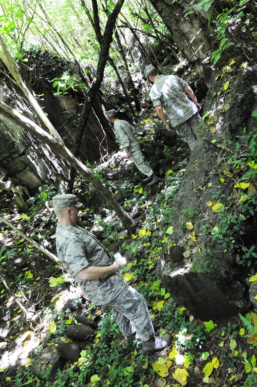ANDERSEN AIR FORCE BASE, Guam – Senior leaders of Team Andersen explore the remnants of a Japanese munitions hold that was destroyed during World War II, Oct. 11 during a staff visit and tour of Tinian Island. While under Japanese occupation, Tinian was largely used as a sugar plantation. (U.S. Air Force photo/ Senior Airman Carlin Leslie)