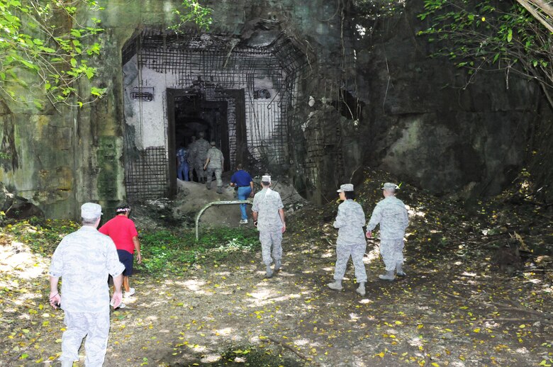 ANDERSEN AIR FORCE BASE, Guam – Senior leaders of Team Andersen explore the remnants of an Japanese fuel hold that was destroyed during World War II, Oct. 11 during a staff visit and tour of Tinian Island. While under Japanese occupation, Tinian was largely used as a sugar plantation. (U.S. Air Force photo/ Senior Airman Carlin Leslie)