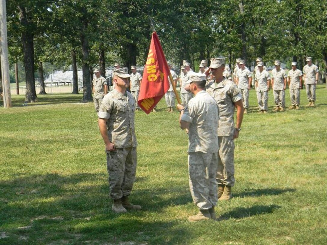 Capt. John Bowe passes the company guidon to Maj. Ernest Lincoln.