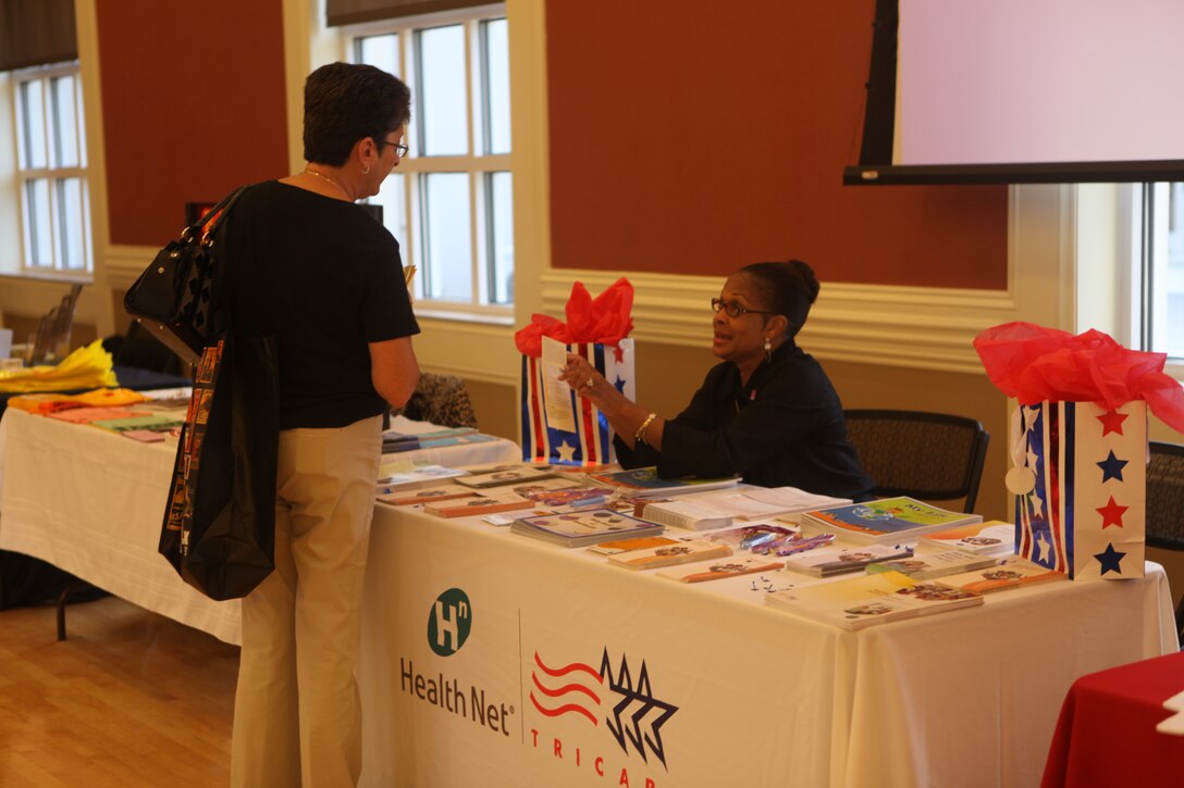 A woman speaks to a representative from Tricare at Marine Corps Community Services’ Lejeune Living event aboard Marine Corps Base Camp Lejeune, Oct. 13. Members of the military community were welcome to the event where they could learn about services and programs available on base. (Official U.S. Marine Corps photo by Pfc. Jackeline M. Perez Rivera)