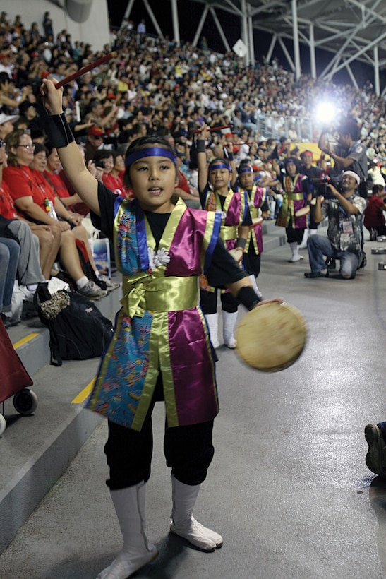 Young Eisa dancers perform in front of an audience during the opening ceremony of the 5th Worldwide Uchinanchu Festival at the Okinawa Cellular Baseball Stadium in downtown Naha Oct. 13.