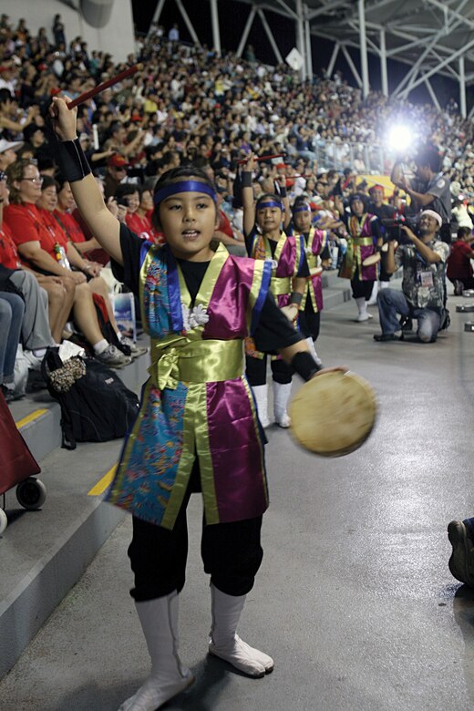Young Eisa dancers perform in front of an audience during the opening ceremony of the 5th Worldwide Uchinanchu Festival at the Okinawa Cellular Baseball Stadium in downtown Naha Oct. 13.