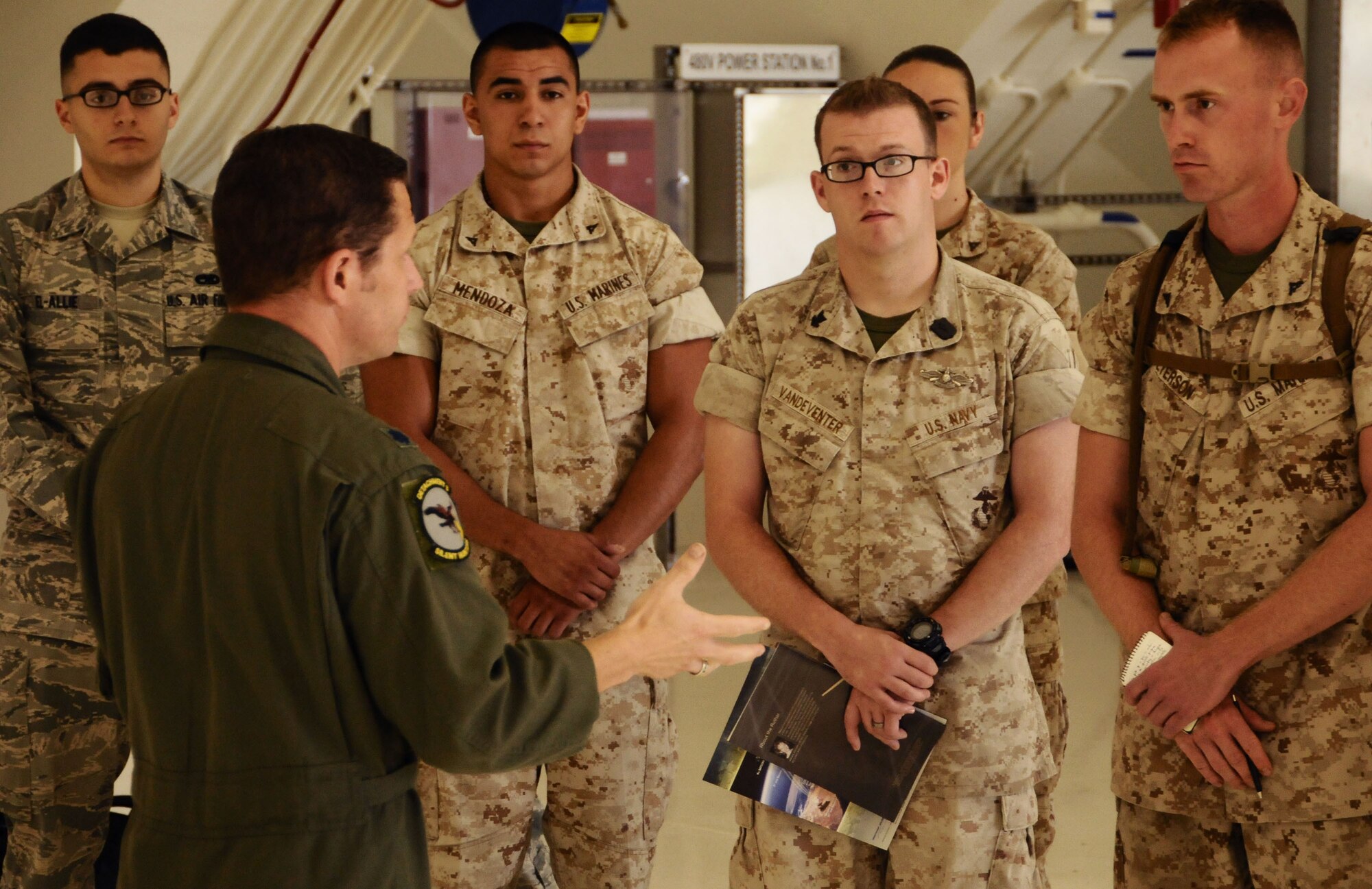 ANDERSEN AIR FORCE BASE, Guam—The commander of the 9th Operations Group Detachment 3 speaks to participants of the Pacific Airpower Tour here, Oct. 12. Different servicemembers had the opportunity to travel around the base and see what Andersen Airmen do on a daily basis.  (U.S. Air Force photo by Senior Airman Benjamin Wiseman/Released)
