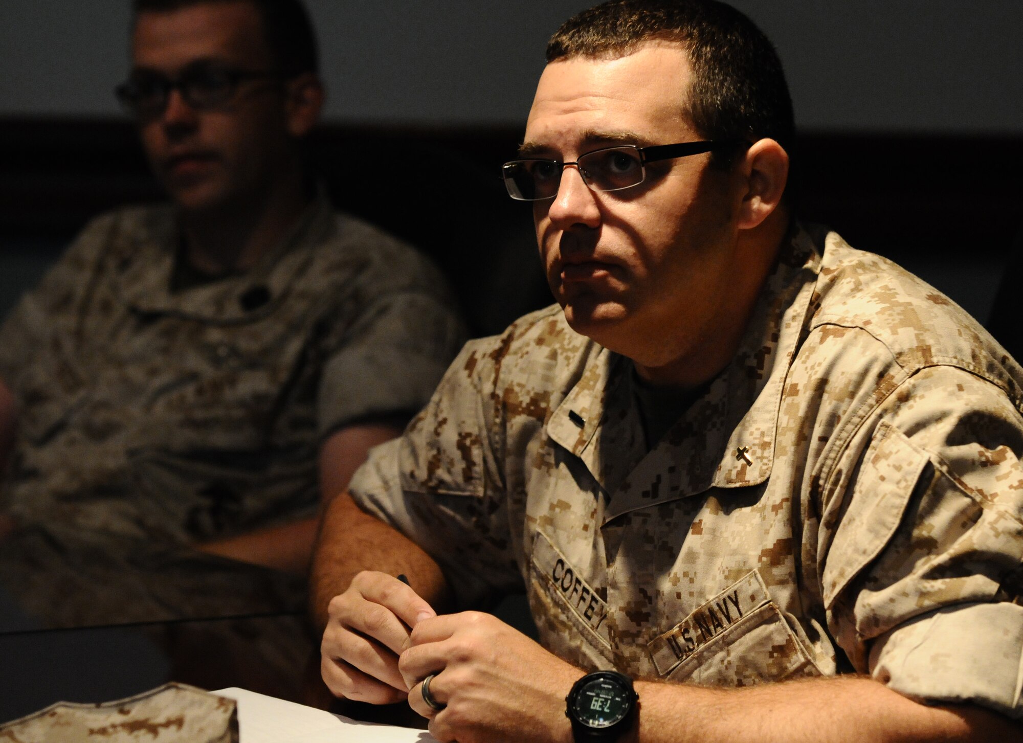 ANDERSEN AIR FORCE BASE, Guam—U.S. Navy Lt. j.g. Travis Coffey, deputy chaplain from Marine Aircraft Group 12, Marine Corps Air Station, Iwakuni, Japan, listens to the Andersen mission brief during a Pacific Airpower Tour here, Oct. 12. The tour gave U.S. Marines, U.S. Navy and U.S. Air Force members the opportunity to see what the total mission of Andersen Air Force Base is and what daily operations are performed around the base.  (U.S. Air Force photo by Senior Airman Benjamin Wiseman/Released)