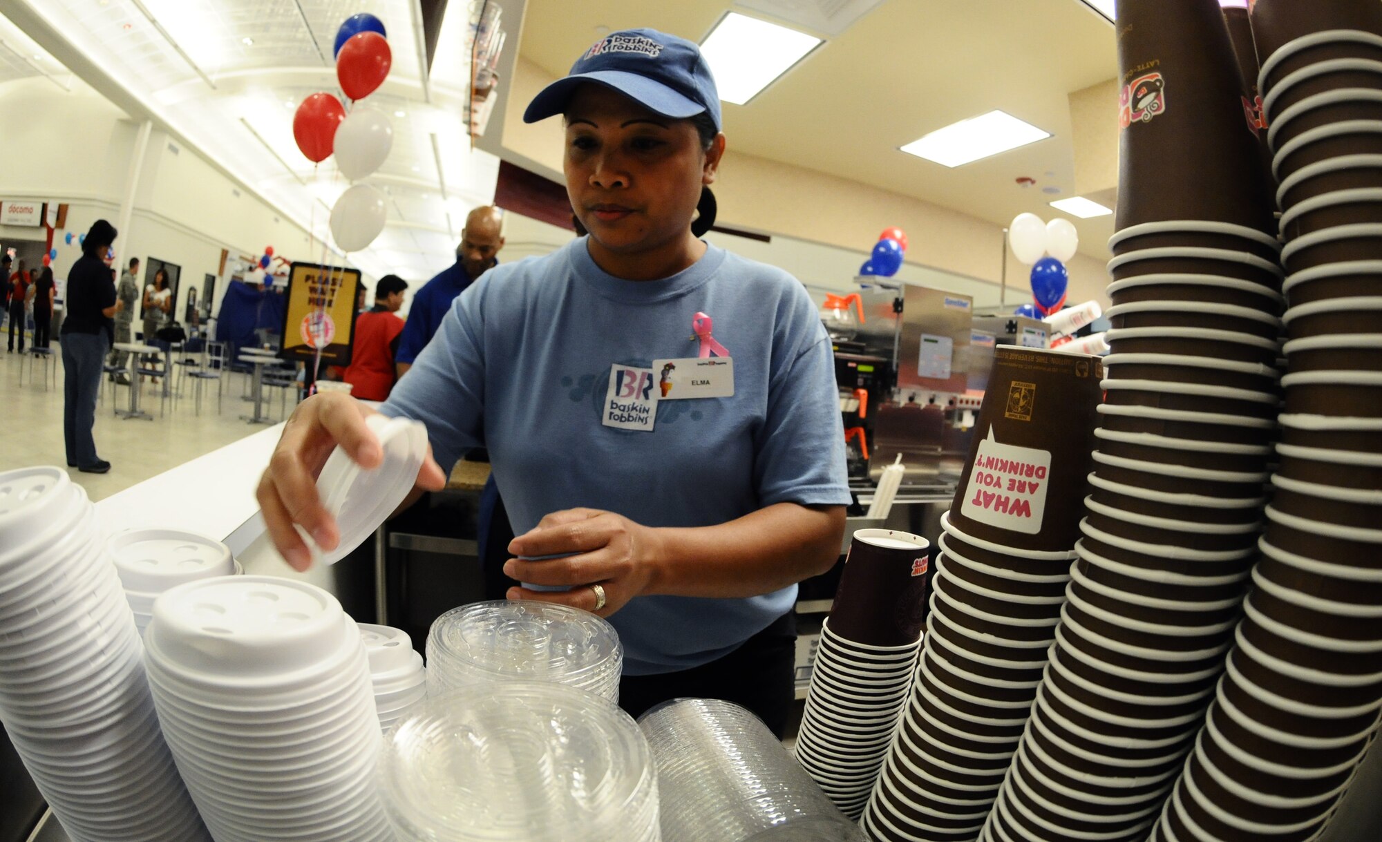 ANDERSEN AIR FORCE BASE, Guam—Elma Sipsy, Exchange employee, makes coffee during the grand opening of the new Duncan Donut coffee shop at the Base Exchange here, Oct. 14. Several members of Team Andersen, to include Brig. Gen. John Doucette, 36th Wing commander, arrived at the BX early to participate in the opening of the new store. (U.S. Air Force photo by Senior Airman Benjamin Wiseman/Released)