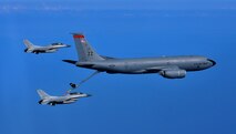 A KC-135 Stratotanker from the 909th Air Refueling Squadron at Kadena AB, Japan, refuels two Republic of Korea Air Force KF-16’s from the 111th Fighter Squadron over the Republic of Korea Sept. 16, 2011. (Courtesy photo)