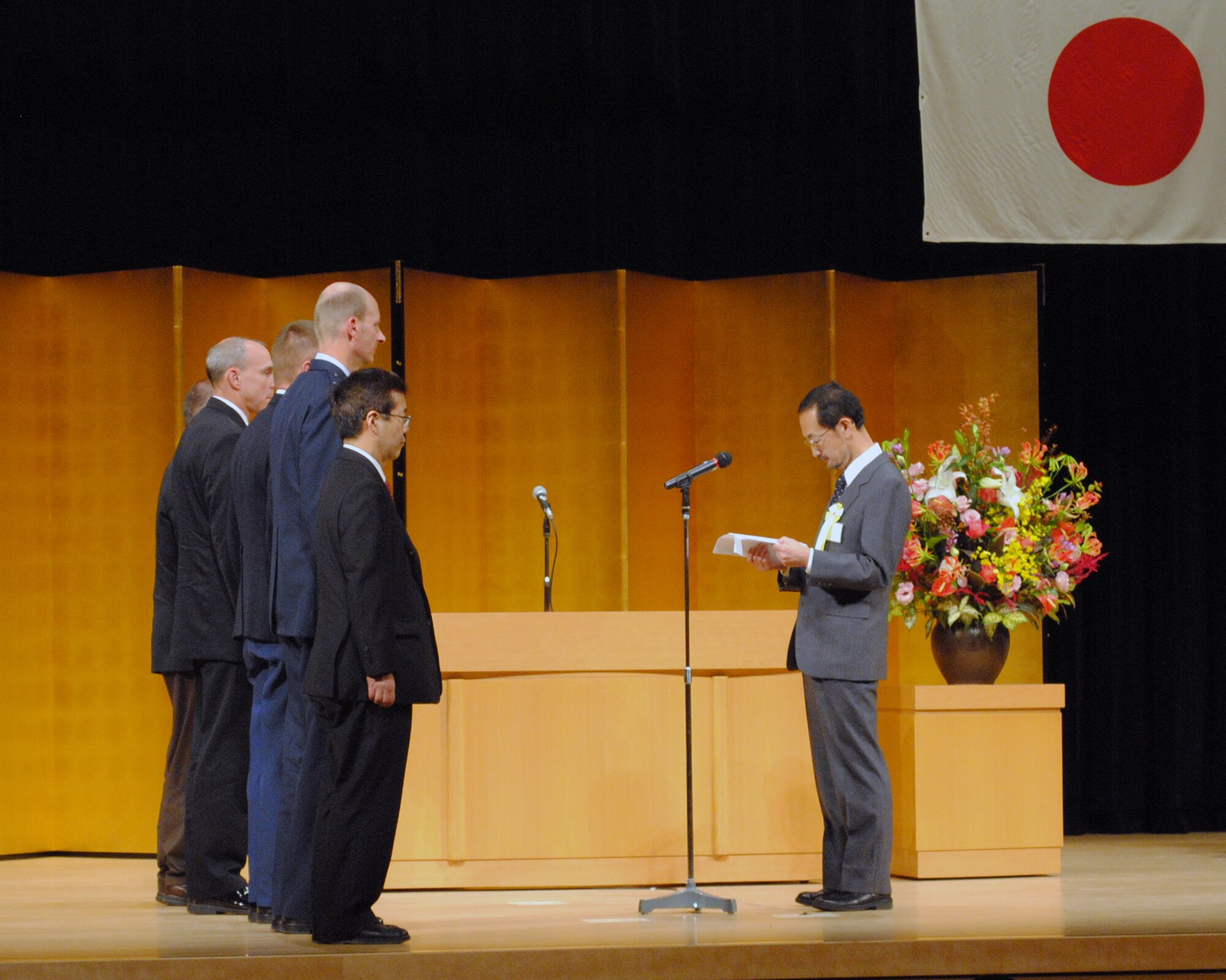 HAMURA, Japan -- Yoshitaka Yamaguchi, 374th Civil Engineering Squadron natural and cultural resources manager, gives an acceptance speech at the 2011 U.S. Forces, Japan Length of Service Awards Ceremony held in Hamura City on Oct. 13, 2011. The ceremony honored 171 Japanese employees who have served with USFJ for 10, 20 and 30 years. (U.S. Air Force photo/Capt. Raymond Geoffroy)

