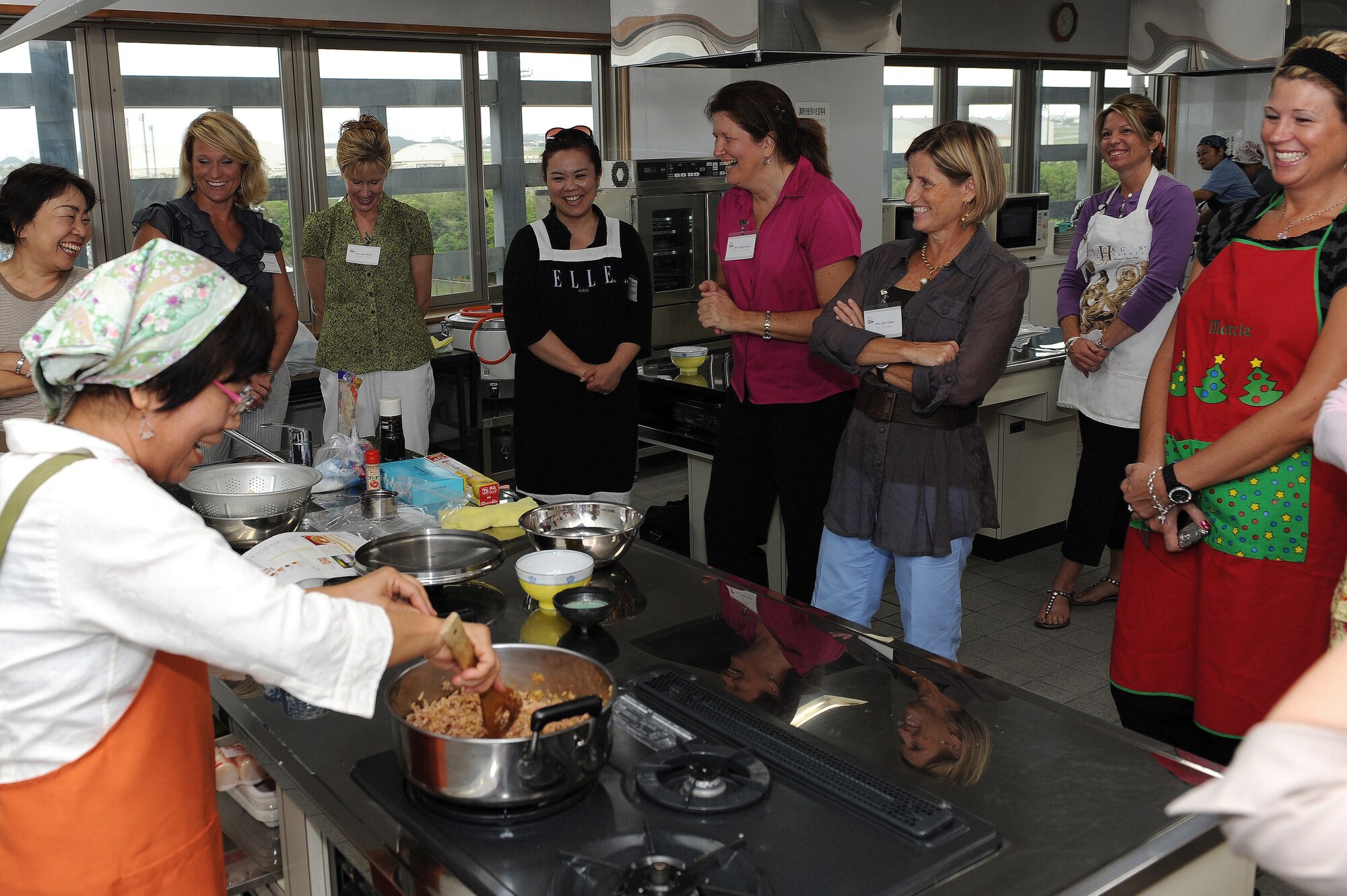 Sachiko Yamada demonstrates how to make Maboo Tofu to participants of a cultural exchange cooking class at the Kadena Town Rotary Plaza Oct. 5. The class was hosted by the Kadena Chamber of Commerce Women’s Division and the 18th Wing Public Affairs community relations office and was a cultural exchange between the local community and members of Kadena Air Base. (U.S. Air Force photo/Junko Kinjo)