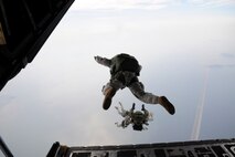 Army members from the Special Operations Command Korea's 39th Special Forces Detachment along with Air Force survival, evasion, resistance and escape specialists jump out of a C-130H Hercules from Yokota Air Base, Japan, at the Gunsan-Saemangeum Airshow in Gunsan City, Republic of Korea, Oct. 9, 2011. The U.S. Air Force and SOCKOR performed the jump together at 10,000 feet from a C-130, highlighting military free-fall operations. The City of Gunsan, the 8th Fighter Wing and the Republic of Korea Air Force’s 38th Fighter Group hosted the air show. (U.S. Air Force photo by Staff Sgt. Rasheen A. Douglas/Released)