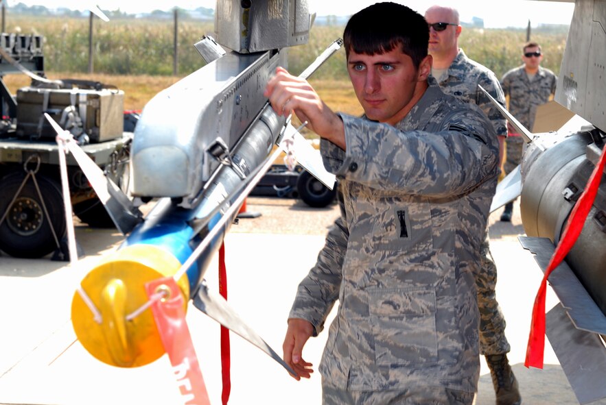 Senior Airman John Weiler, 8th Aircraft Maintenance Squadron weapons load crew member, performs the necessary steps of downloading a standard combat load during his team’s load crew demo as part of the 2011 Gunsan-Saemangeum Air Show at Kunsan Air Base, Republic of Korea, Oct. 8, 2011. The air show featured many static displays and performances from across the Pacific Air Forces and Korean peninsula. (U.S. Air Force photo by Senior Airman Benjamin Stratton/Released)