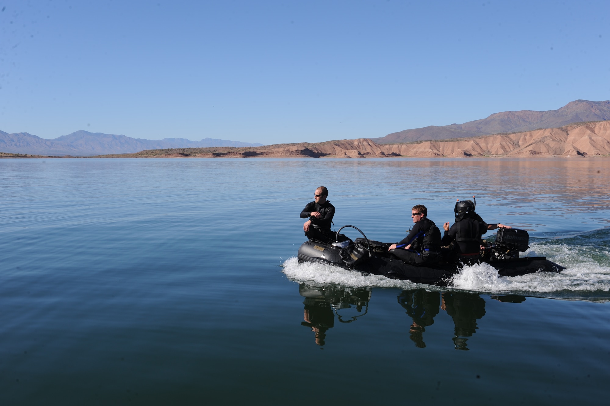 DAVIS-MONTHAN AIR FORCE BASE, Ariz. – Air Force pararescuemen navigate their way to an underwater site where they perform their exercise for Angel Thunder at Lake Roosevelt Oct. 11. Approximately 1,400 U.S. Military, federal and state employees, and coalition forces are participating in the fifth annual Angel Thunder exercise, the largest military combat search and rescue exercise in the world. (U.S. Air Force photo/Airman 1st Class Christine Griffiths)