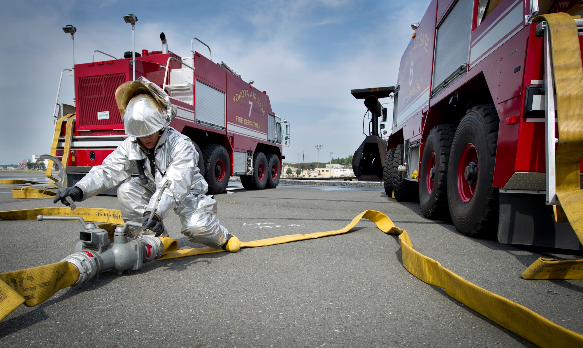 YOKOTA AIR BASE, Japan -- Firefighters from the 374th Civil Engineer Squadron extinguish a fire on an simulated aircraft, Oct. 11, 2011, during a live-fire training exercise at Yokota Air Base, Japan. The firefighters participate in this type of training to keep their skills sharp and always stay ready for fire emergencies. (U.S. Air Force photo/ Staff Sgt. Stacy Moless)