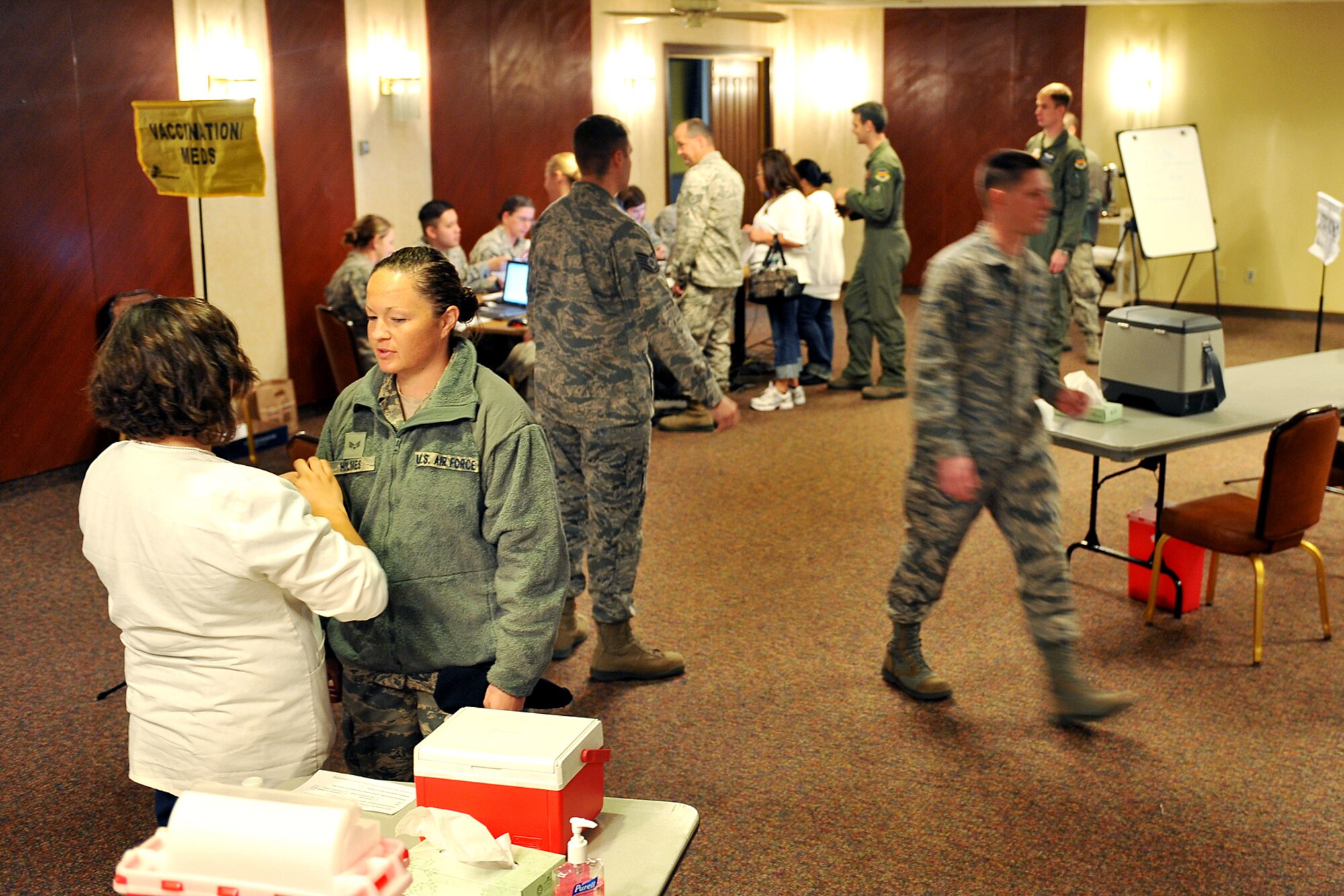 The 55th Medical Group participates in a point of dispensing exercise in the Community Activity Center on Offutt Air Force Base, Neb., Oct. 7. Team Offutt members were able to get their annual influenza vaccination during the exercise, and most were able to complete the process in five minutes.

(U.S. Air Force photo by Charles Haymond/Released)
