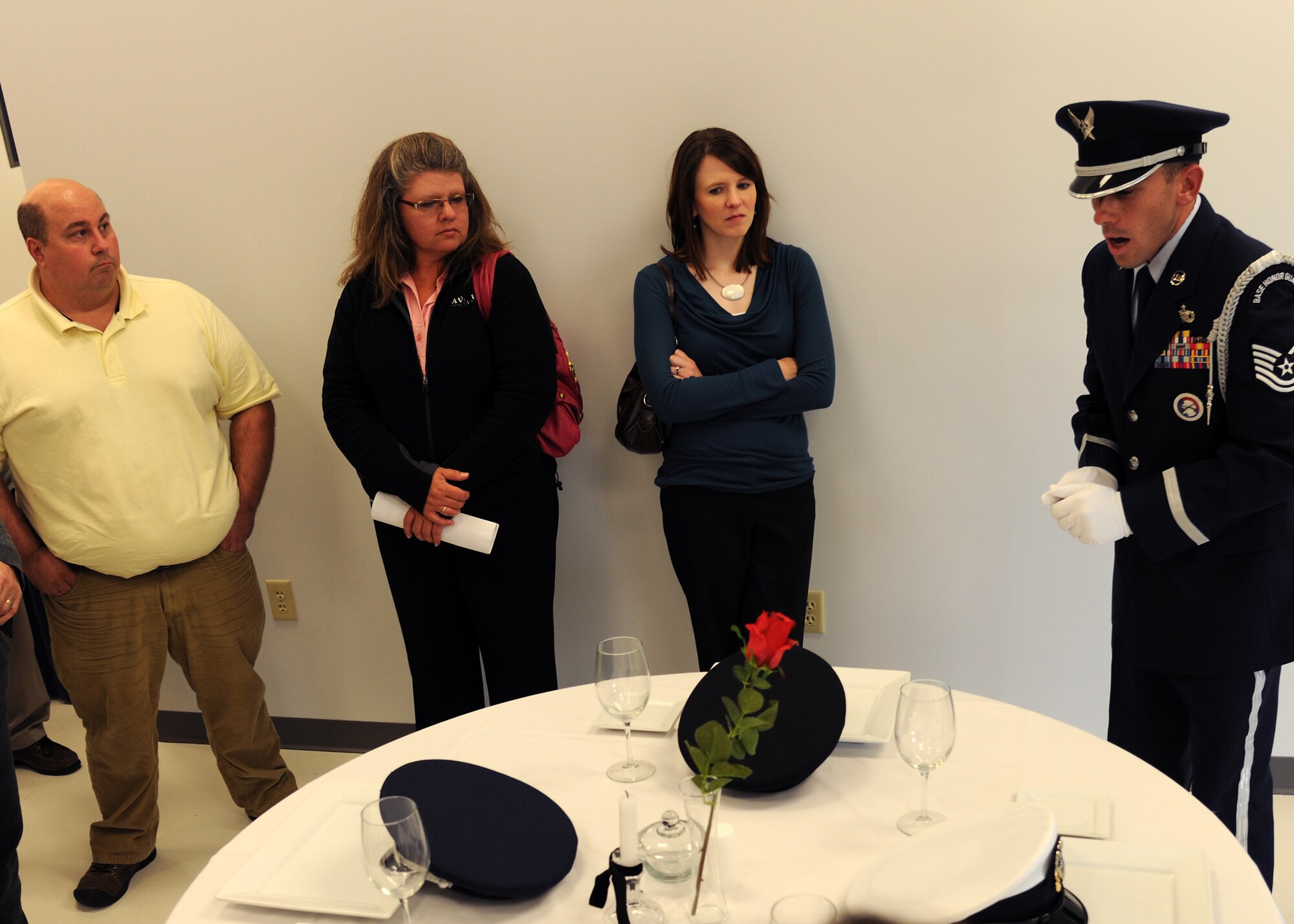 U.S. Air Force Tech. Sgt. Derek Worrall, 319th Air Base Wing Honor Guard program manager, gives a presentation to members of the Grand Forks/East Grand Forks Chamber of Commerce during a day-long base tour on Oct. 12 on Grand Forks Air Force Base, N.D. The chamber holds the annual training to help develop local leaders and officials say the visit to the base is important to helping civilians in the course understand the importance of the military in the community. (U.S. Air Force photo by Airman 1st Class Ashley N. Taylor)