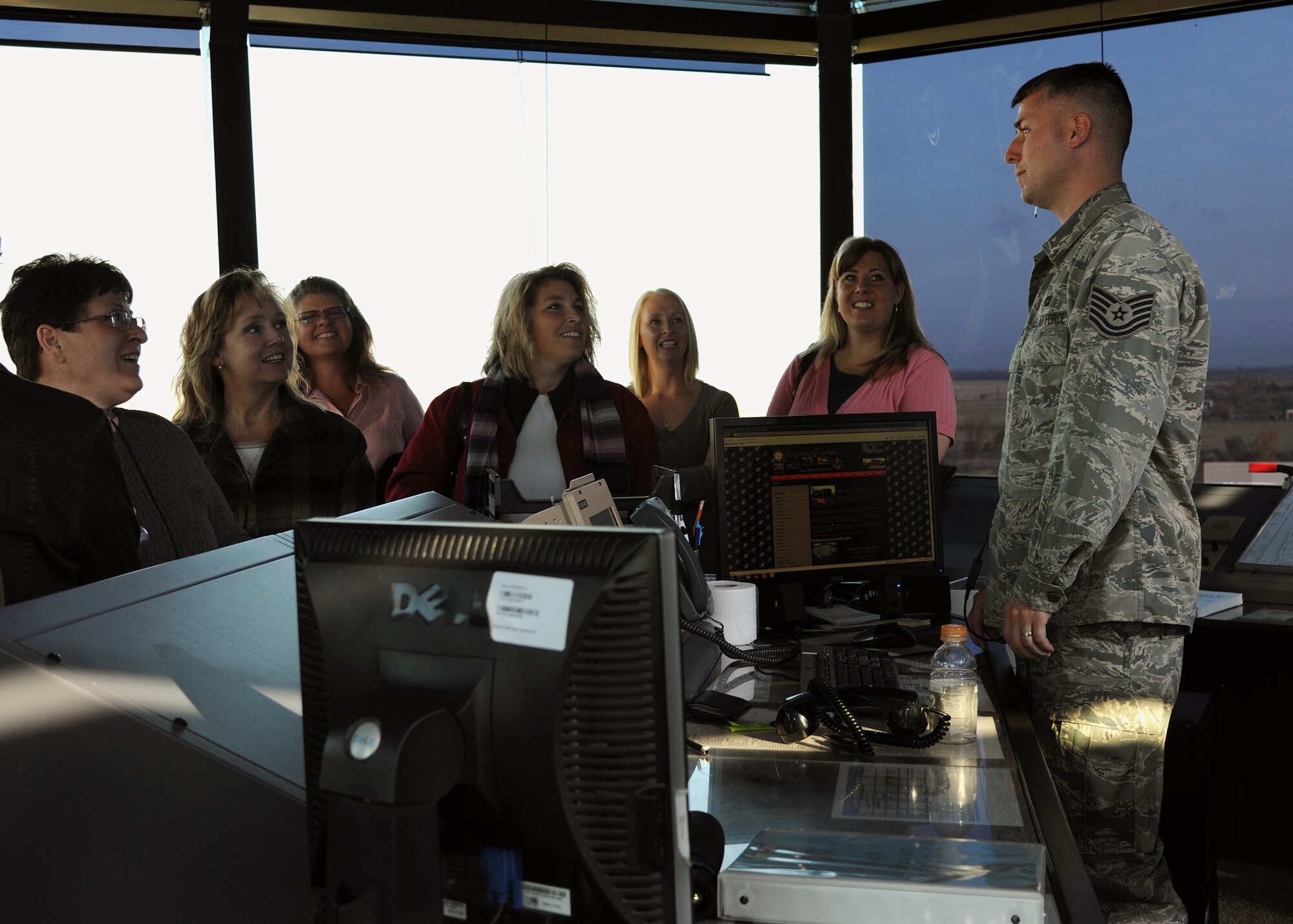 U.S. Air Force Tech. Sgt. Sean Strong of the 319th Operations Support Squadron talks to members of the Grand Forks/East Grand Forks Chamber of Commerce during a presentation at the radar approach control tower during a day-long base tour on Oct. 12 on Grand Forks Air Force Base, N.D. The chamber holds the annual training to help develop local leaders and officials say the visit to the base is important to helping civilians in the course understand the importance of the military in the community. (U.S. Air Force photo by Airman 1st Class Ashley N. Taylor)