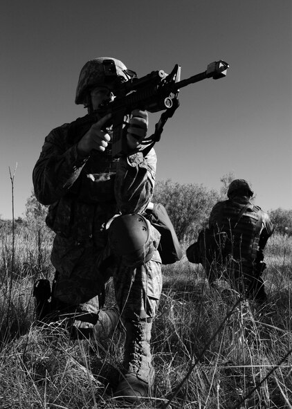 Airman 1st Class Sean Hollearn, 7th Security Forces Squadron, provides cover for his wingman during training Oct. 13, 2011 at Dyess Air Force Base, Texas for the upcoming Global Strike Challenge. During the competition Dyess security forces will compete in marksmanship on the M-4, M-9, M-240 and M-230 weapons systems, combat tactics and priority resource defense, and the mental and physical challenge event. (U.S. Air Force photo by Airman 1st Class Jonathan Stefanko/ Released)