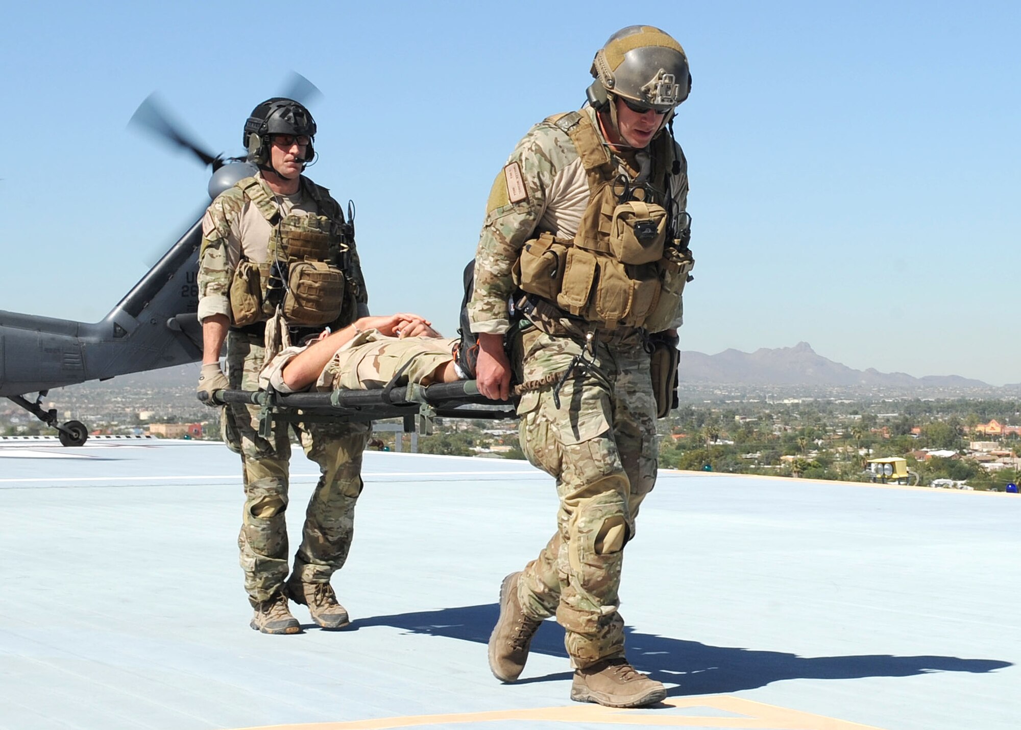 Participants of Angel Thunder carry a patient with simulated wounds to the care of medics at University of Arizona Medical Center Oct. 11. Approximately 1,400 U.S. Military, federal and state employees, and coalition forces are participating in the fifth-annual Angel Thunder exercise, the largest military combat search and rescue exercise in the world. (U.S. Air Force photo by Senior Airman Brittany Dowdle)