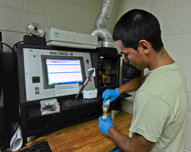 U.S. Air Force Airman 1st Class Dominic Urrutia, 23rd Equipment Maintenance Squadron non-destruction inspections apprentice, uses the joint oil analysis program to test elements during an oil analysis at Moody Air Force Base, Ga., Oct. 11, 2011. Oil analysis is performed during routine preventive maintenance to provide accurate information on lubricant and machine condition. (U.S. Air Force photo by Staff Sgt. Stephanie Mancha/Released)
