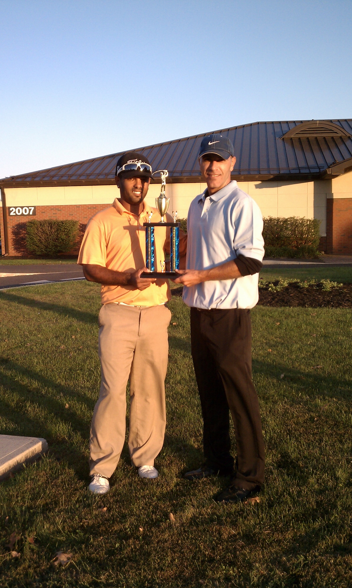 The intramural golf team, representing the 87th Force Support Squadron, hold up their 2011 Intramural Joint Base McGuire-Dix Golf Base Championship trophy at Falcon Creek Golf Course after finishing first during the last golf round of the season. The team amassed an impressive record of fifteen wins and one loss with a 0.938 percentage. (Courtesy photo/Released) 