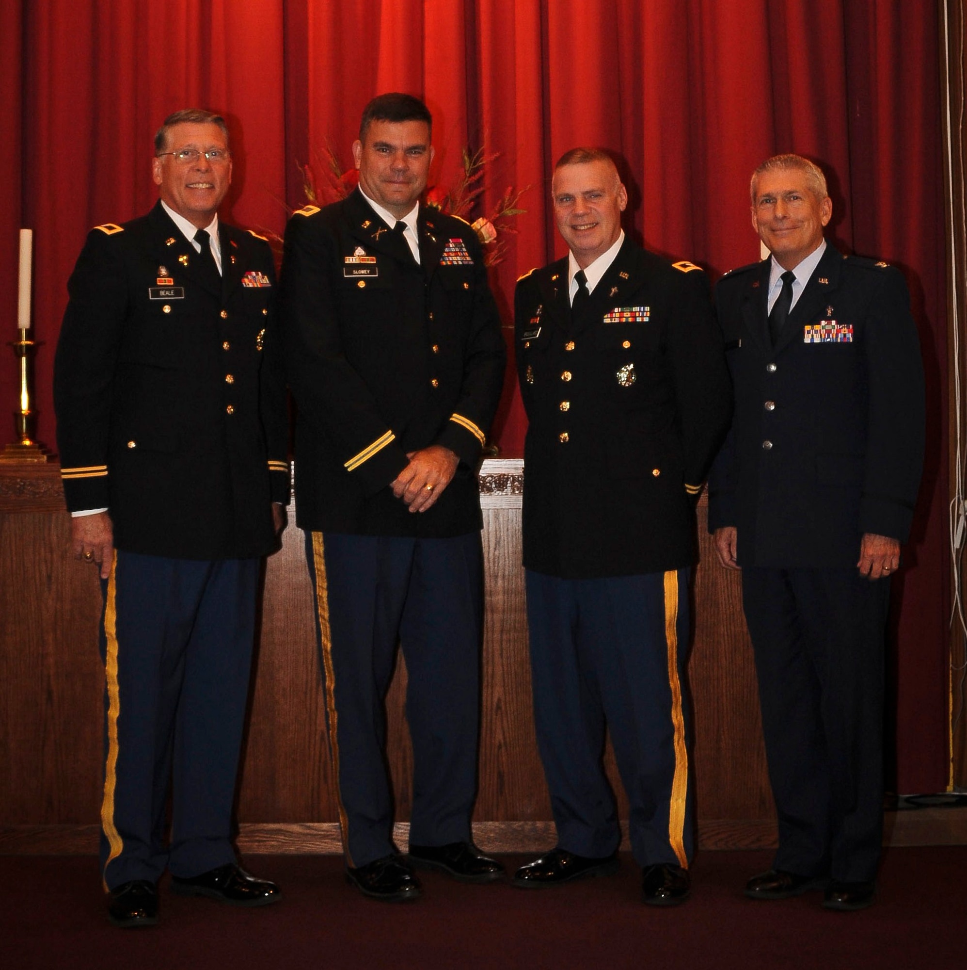 Chaplain (Col.) Kenneth Beale, ASA-Dix command chaplain; Col. Patrick Slowey, ASA-Dix commander; Chaplin (Col.) Thomas Brouillard, former ASA-Dix command chaplain; and Chaplain (Col.) Timothy Wagoner, joint base installation chaplain, joined together to cut the ribbon Oct. 12, officially unveiling the newly-renovated Soldiers Chapel. The chapel underwent renovations to the exterior, interior and structure, totaling $350,000. (U.S. Air Force photo by Airman 1st Class Dennis L. Sloan/Released)