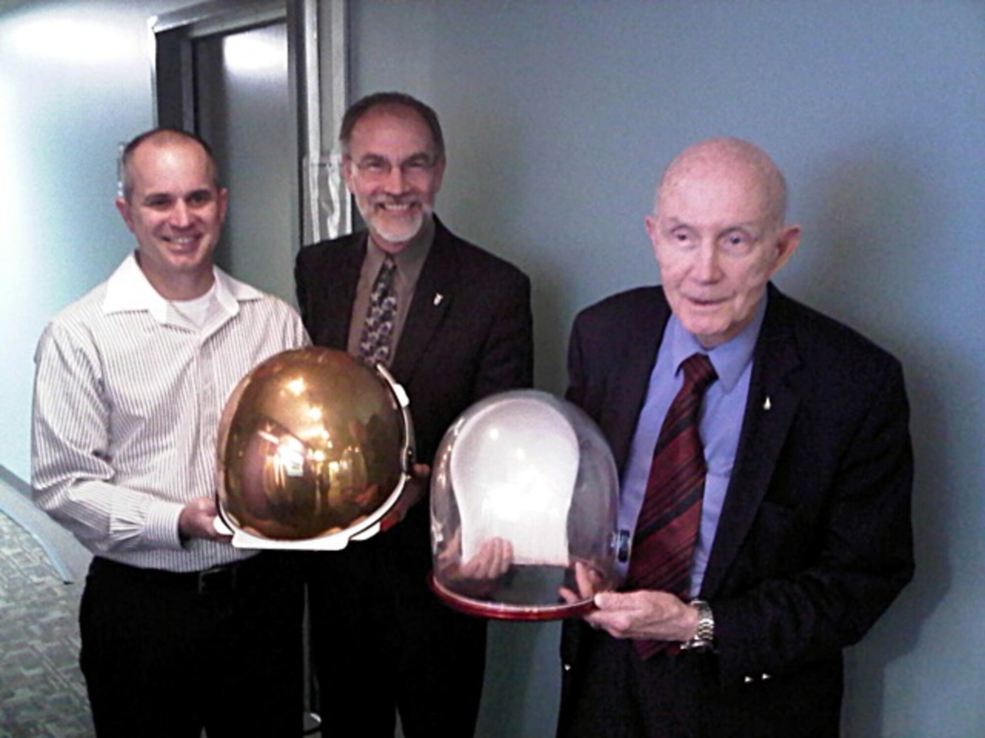 During a visit to the 711th Human Performance Wing, former astronaut Lt. Gen. (Ret.) Thomas P. Stafford took time to inspect the helmet assembly for Apollo missions that was recently found in Bldg. 248.
